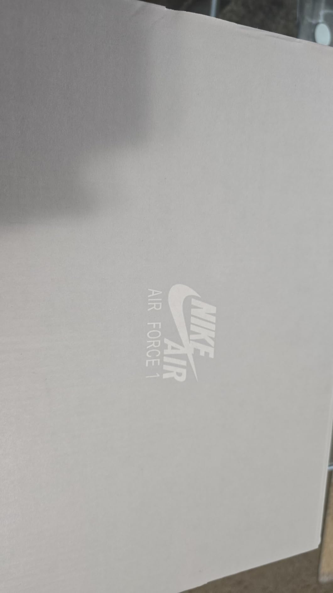 Close-up view of Nike Air Force 1 leather upper construction showing quality stitching and materials