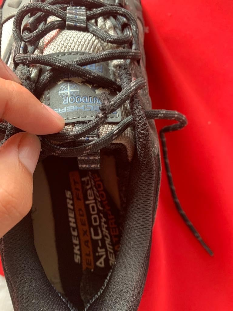 Waterproof testing showing Skechers hiking shoes in wet conditions with water beading off surface