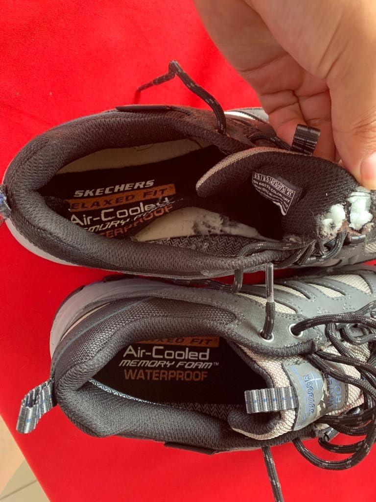 Lifestyle shot of Skechers Selmen-Enago hiking shoes in outdoor casual setting