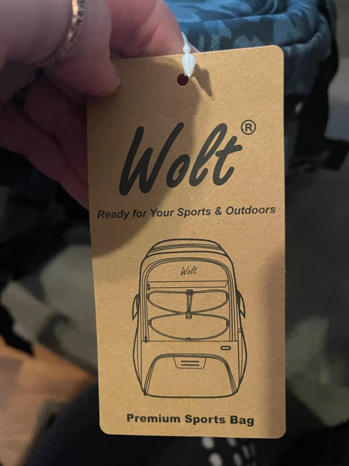 WOLT Basketball Backpack side view showing mesh water bottle pockets and external features