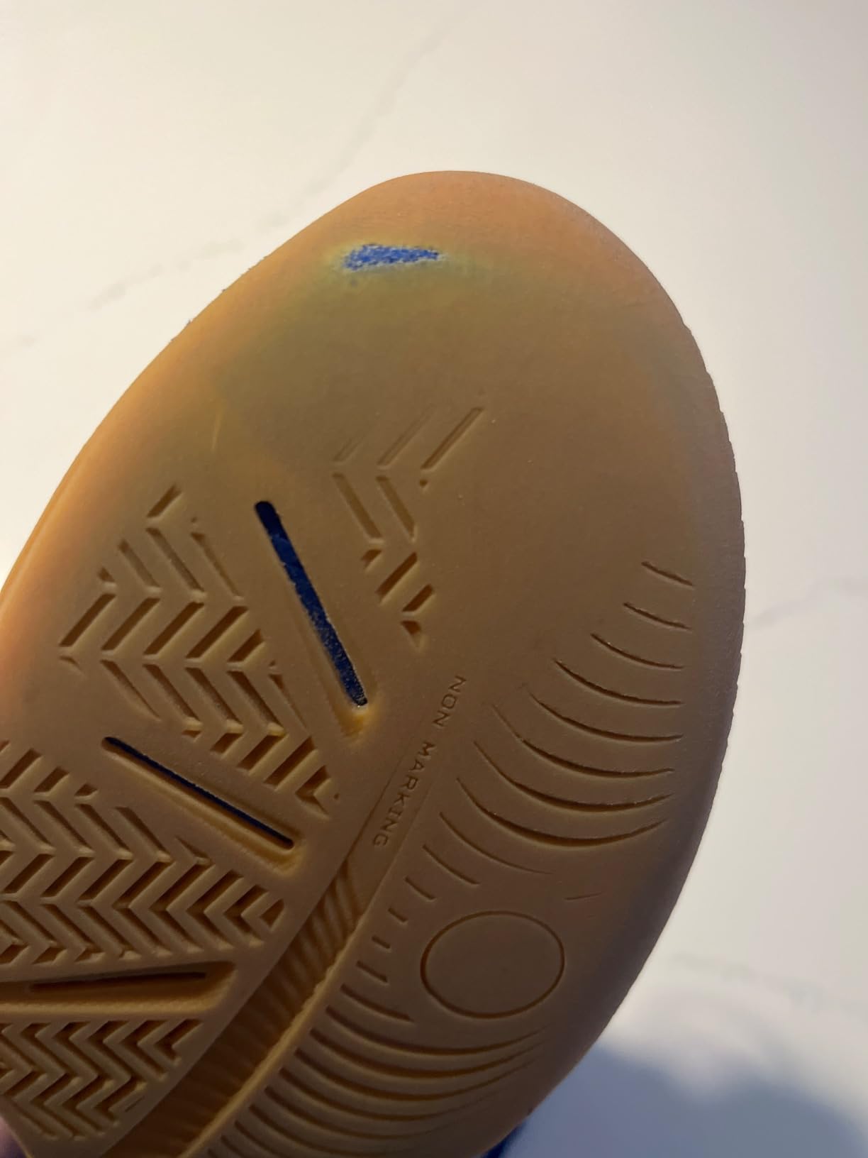 ASICS Gel-RENMA sole showing wear patterns after extended court use