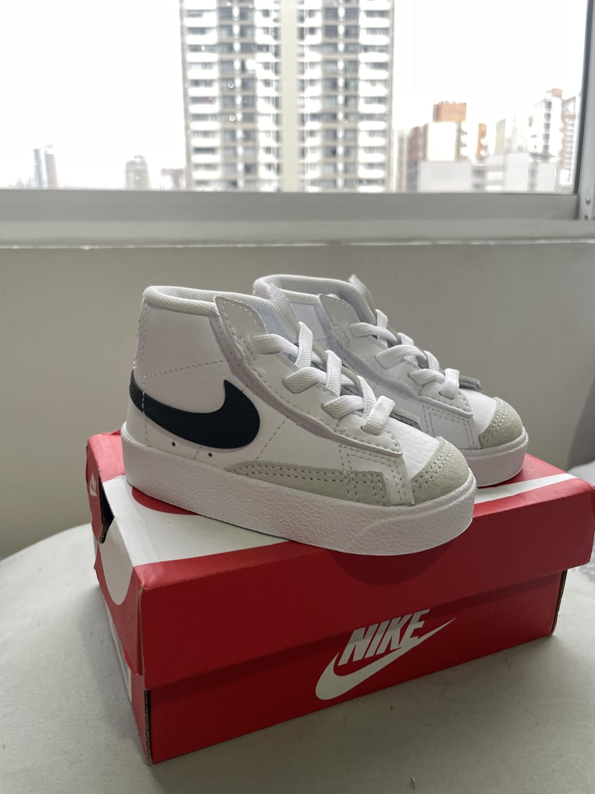 Nike Kids Blazer Mid 77 side profile showing classic basketball high top silhouette and rubber sole
