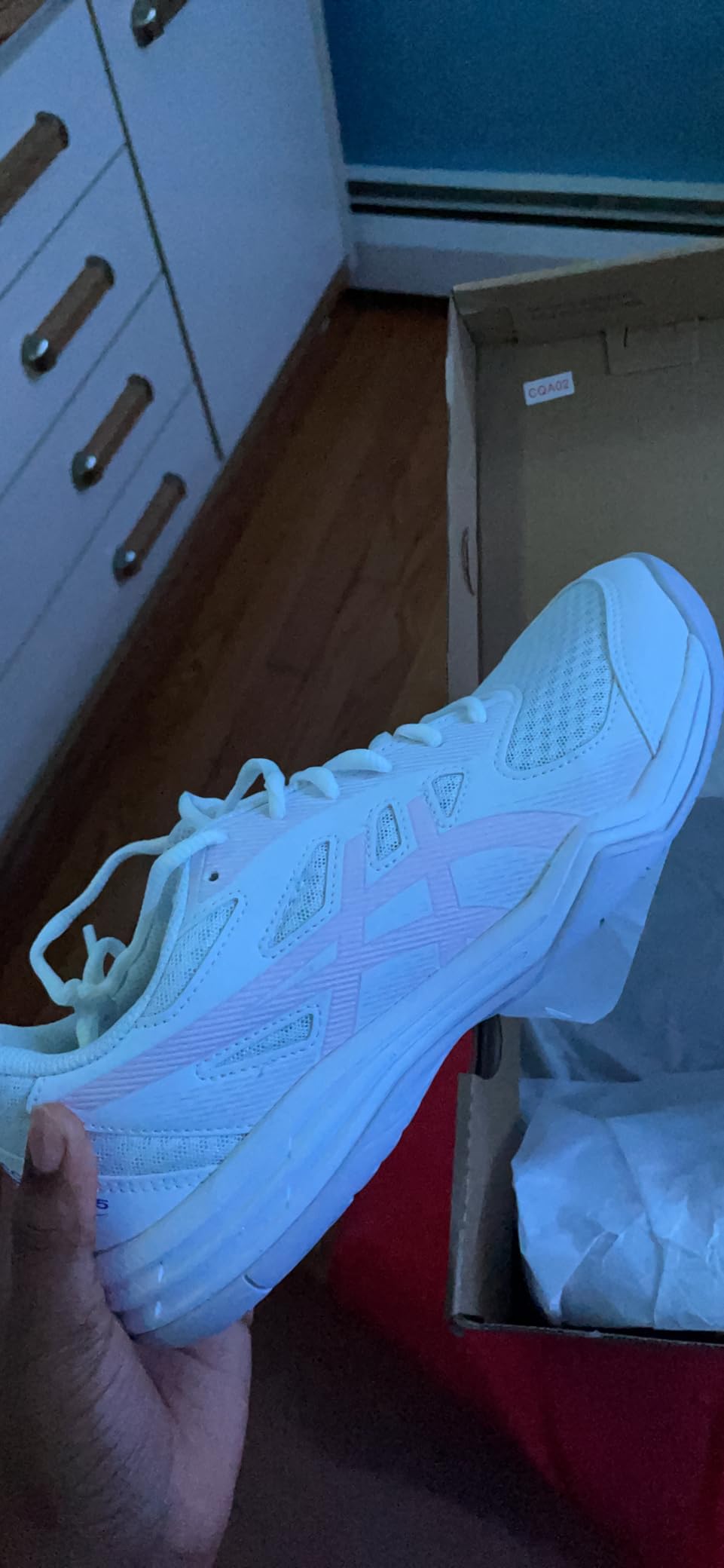 ASICS Upcourt 5 showing side profile design and supportive overlays