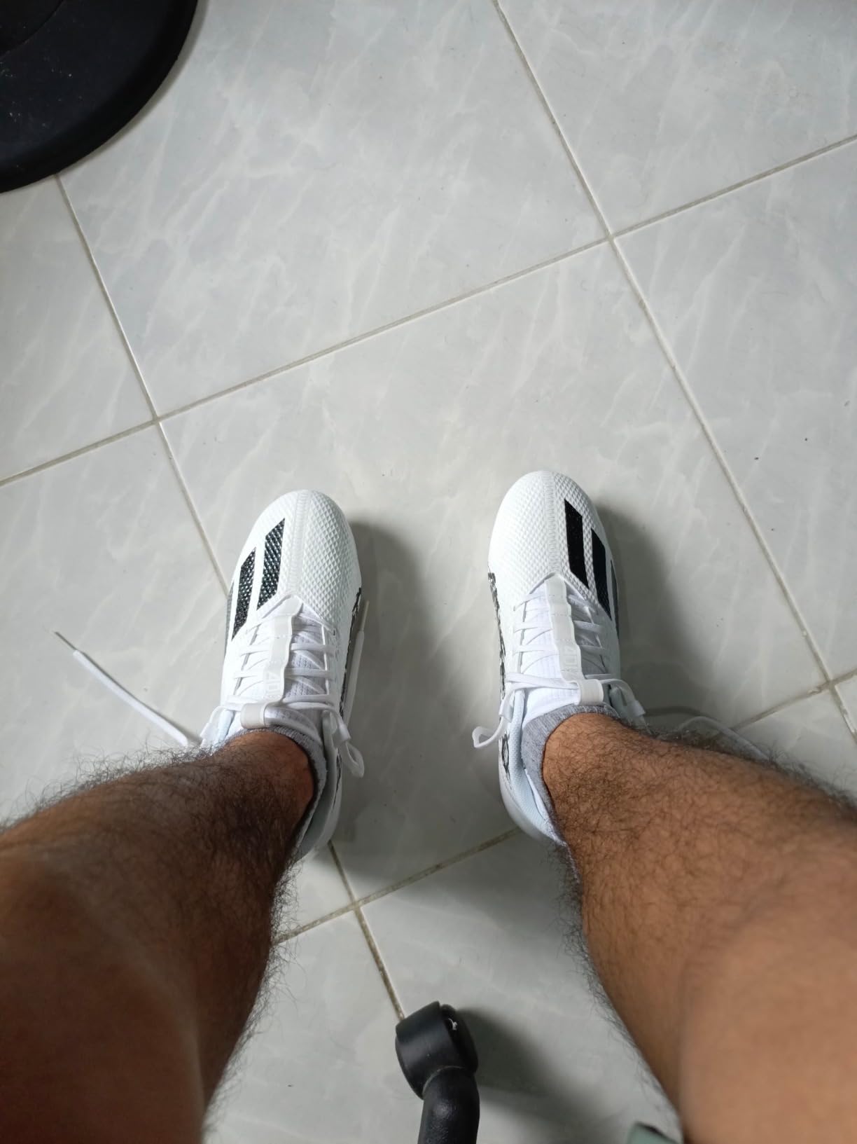 Adidas Adizero Scorch cleats side view showing sock-like upper construction and stud pattern