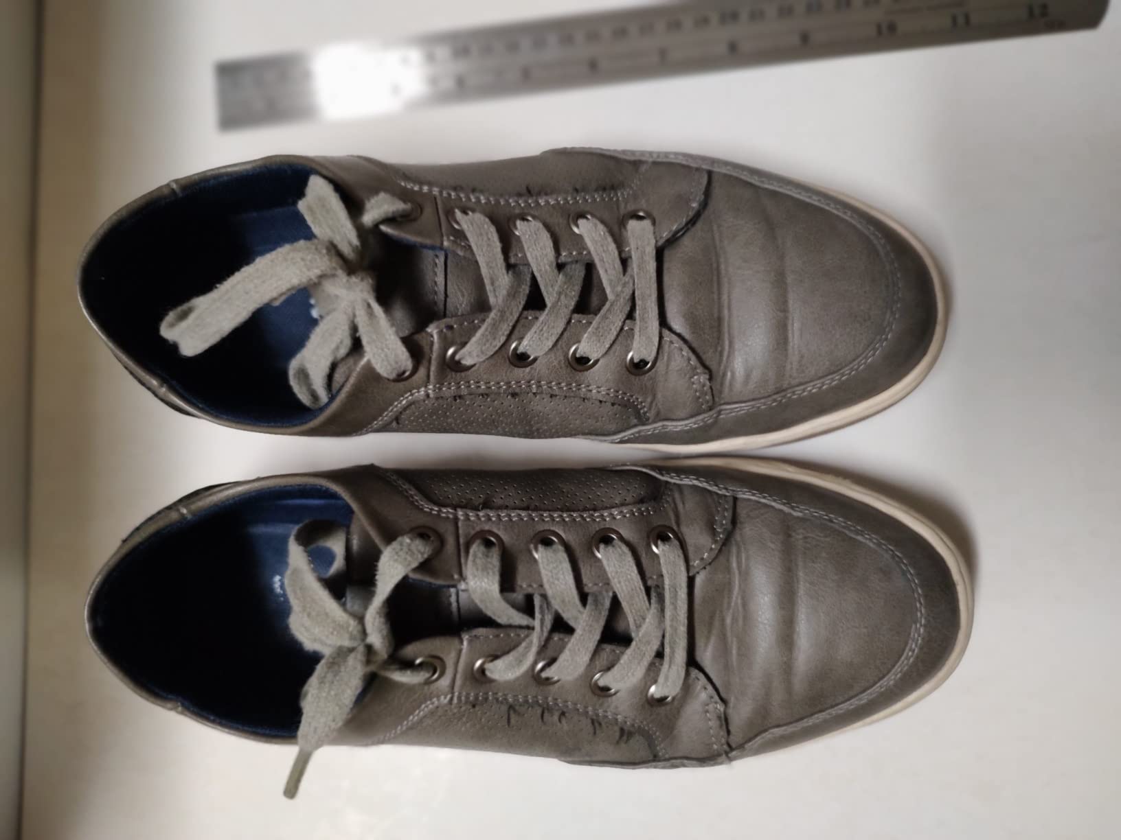 Vostey sneaker sole separation showing laminated rubber construction and durability issues after extended wear
