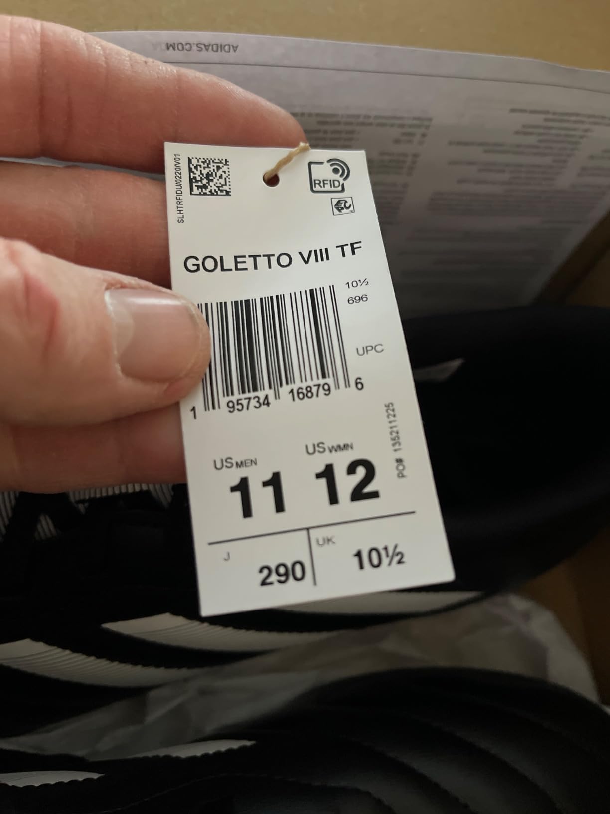 Close-up view of adidas Goletto VIII showing synthetic upper construction and three stripes design detail