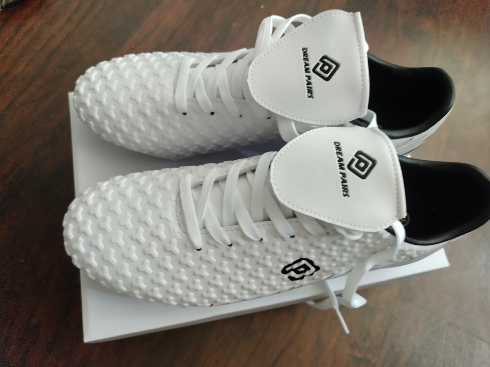 DREAM PAIRS cleats showing wear patterns after extended field testing
