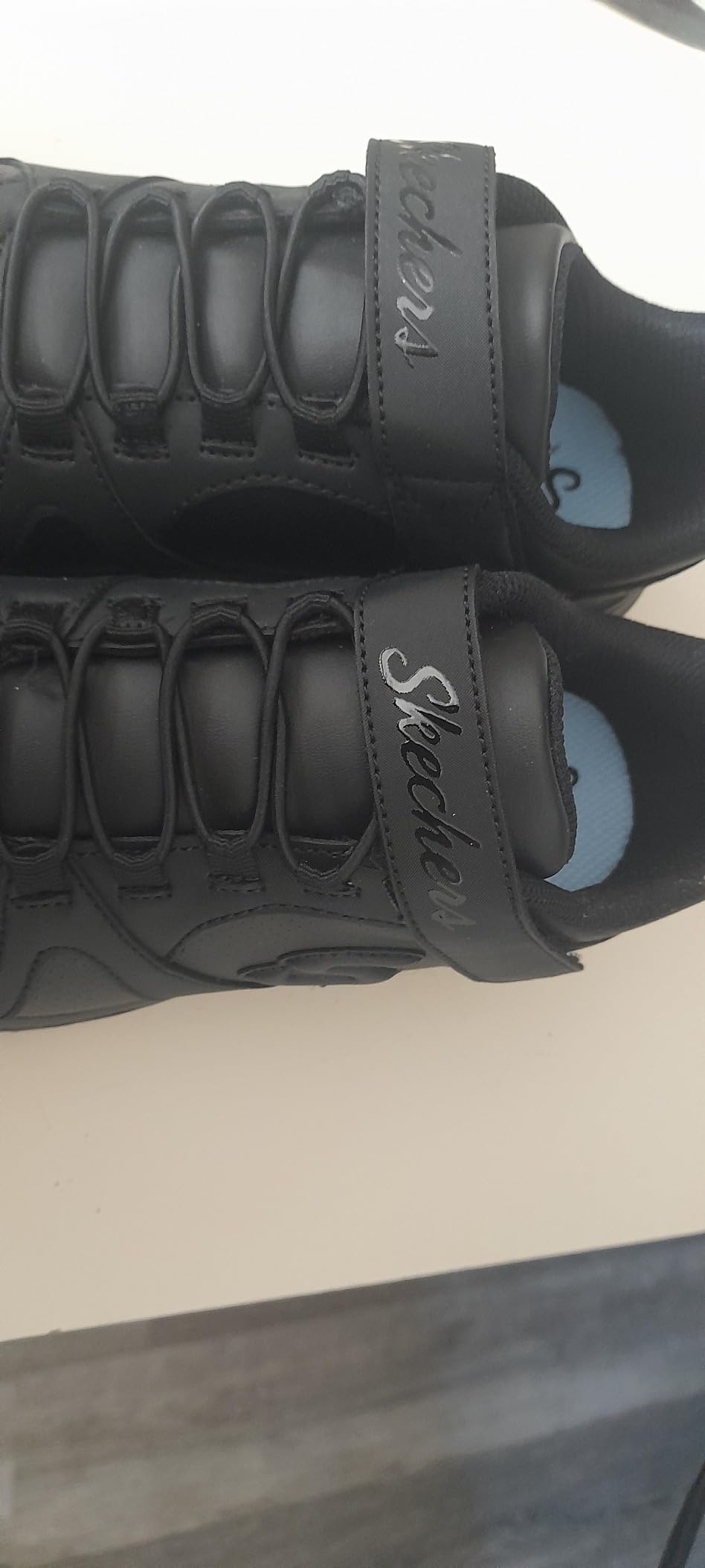 Side profile of Skechers Girls Glimmer Kicks showing lightweight sole design and overall silhouette