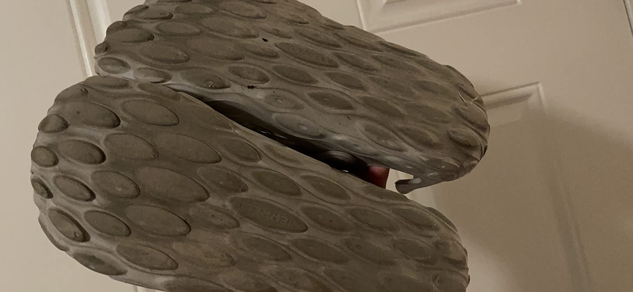 Close-up of Merrell Hydro Moc heel design showing articulated heel cup and adjustable strap system