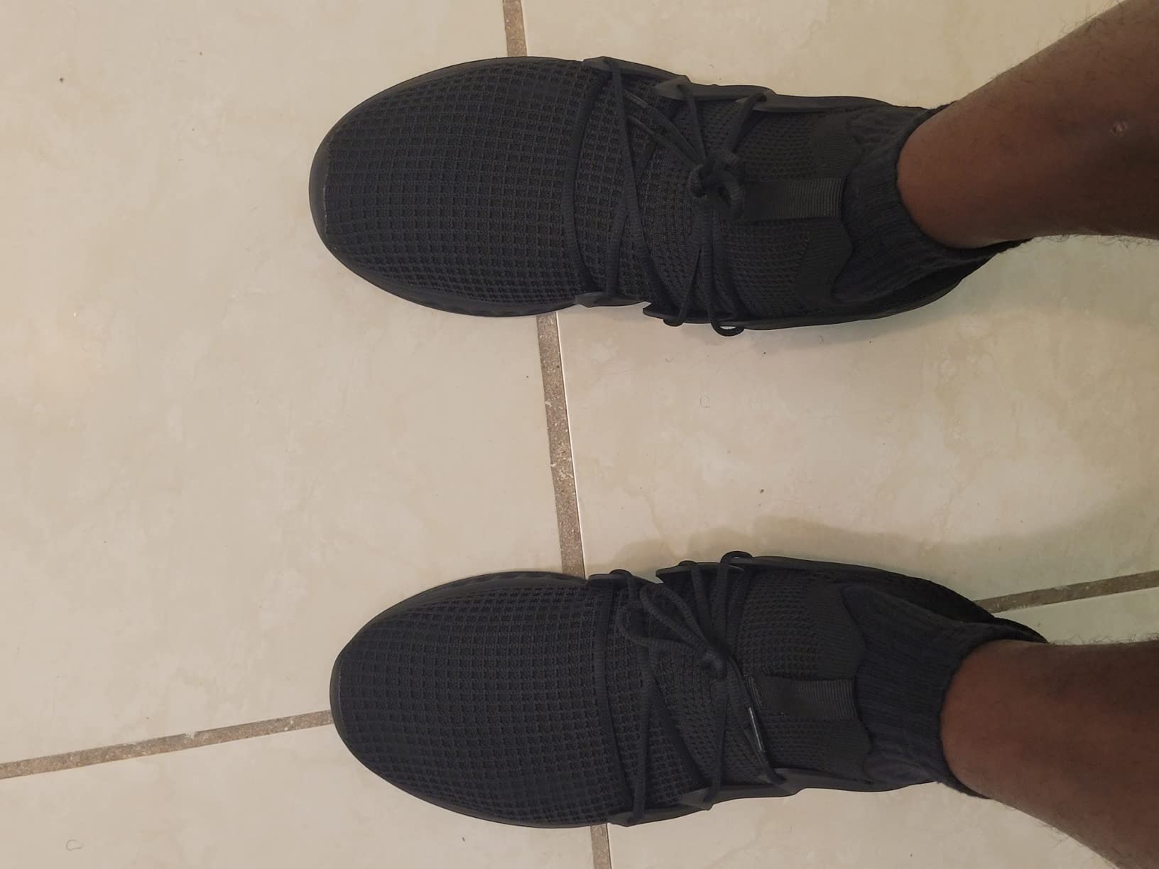 Side angle showing Pujcs shoes ergonomic design and non-slip rubber outsole pattern