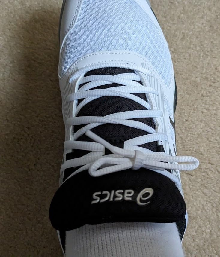ASICS Upcourt 5 showing heel counter and toe reinforcement areas for durability