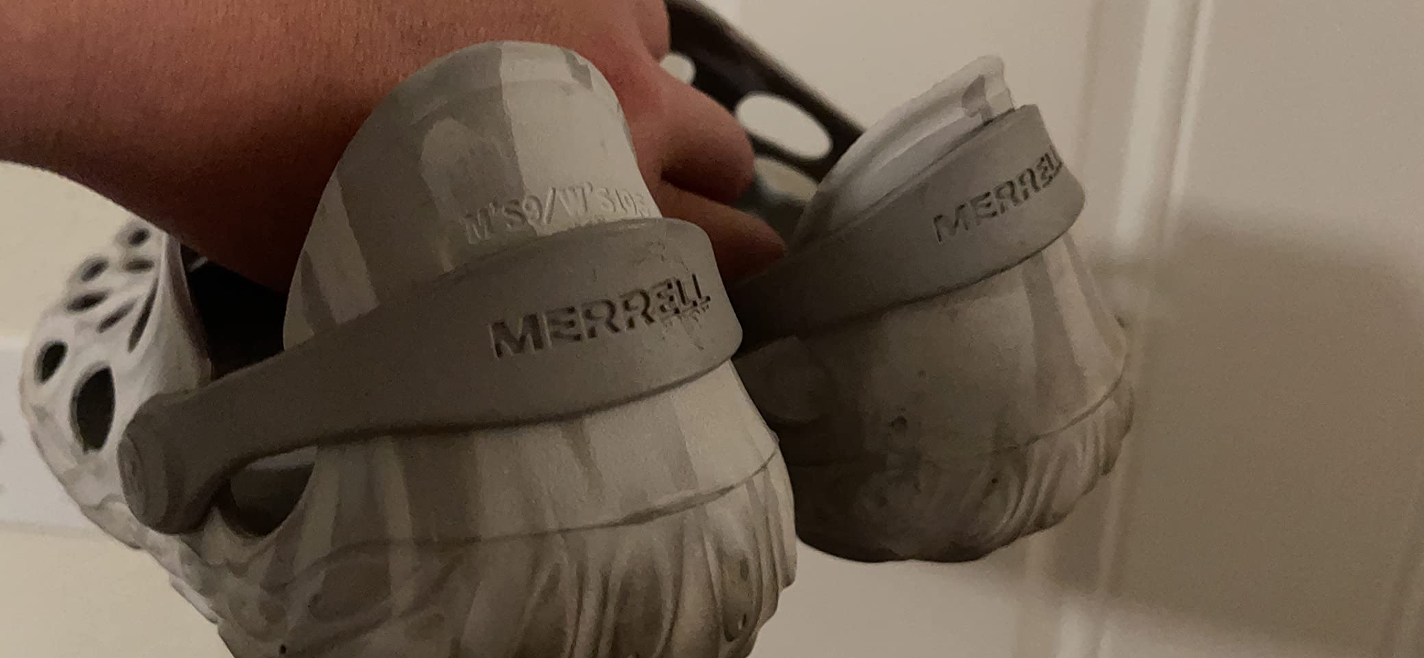 Multiple colorways of Merrell Hydro Mocs displayed showing orange, blue, and neutral color options