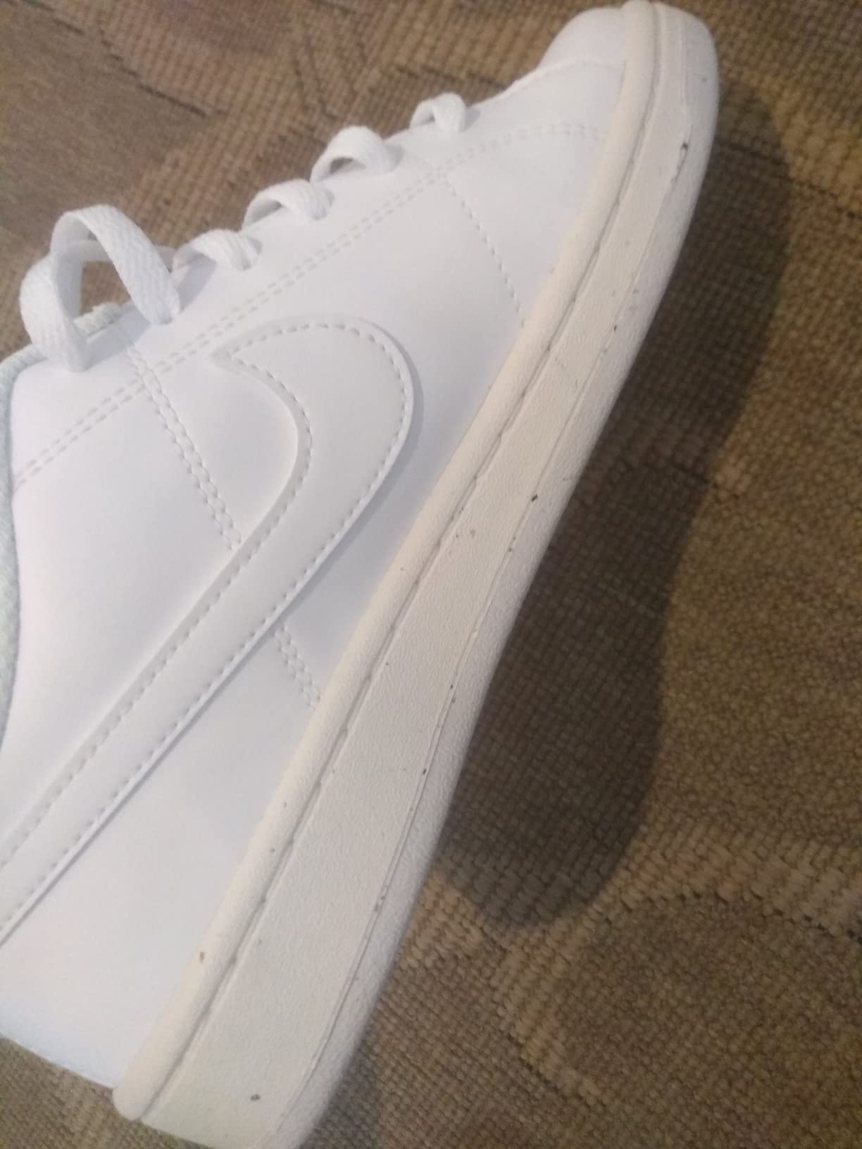 Close-up detail of Nike shoe construction showing stitching quality and material junction points