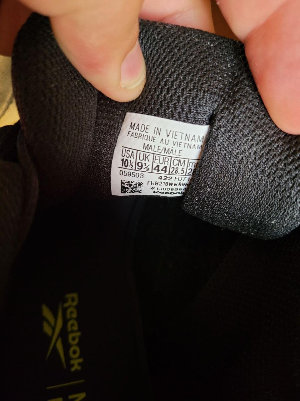 Close-up view of Reebok DMX Max walking shoe showing leather construction and cushioning details