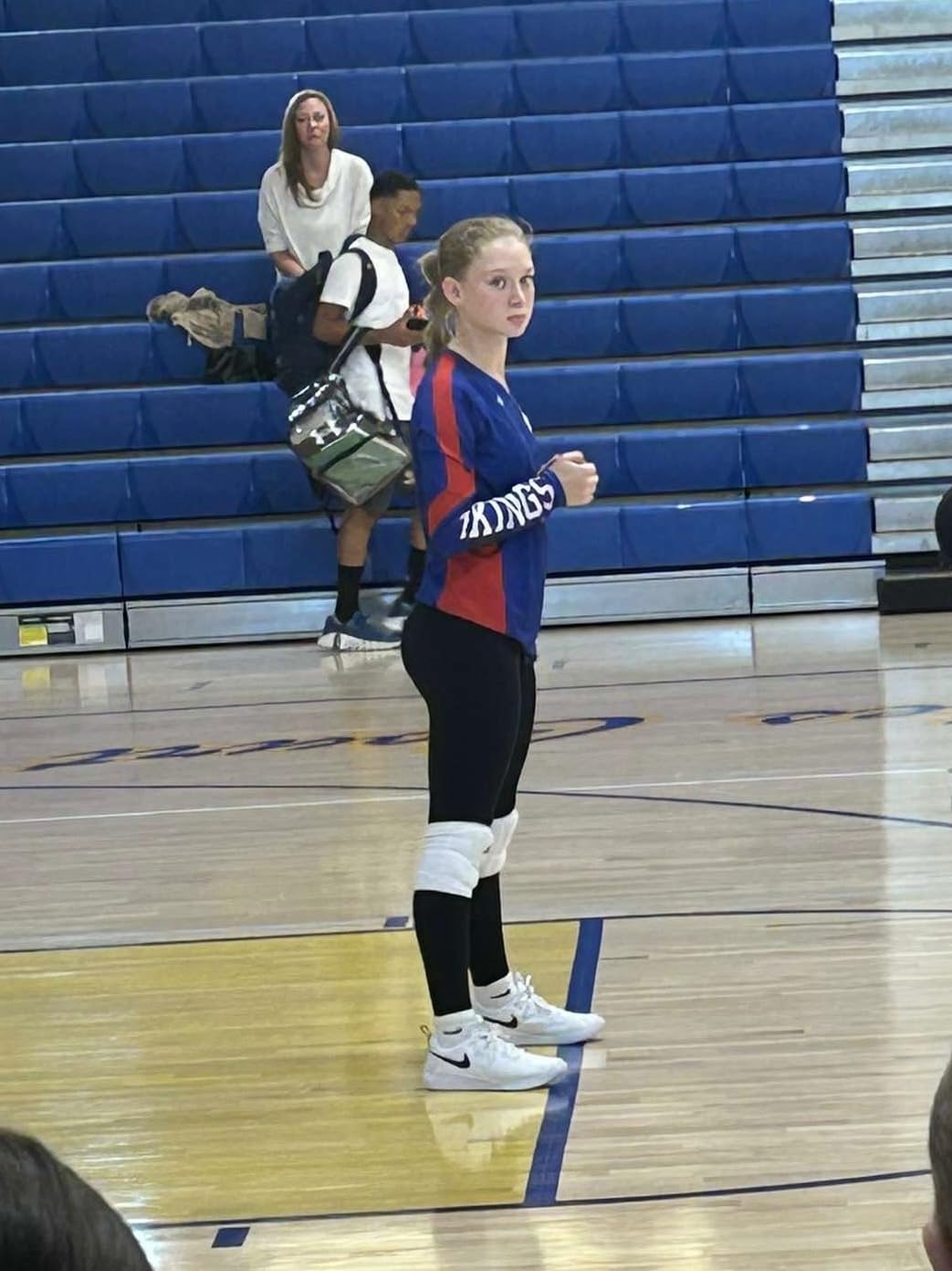 Action shot of Nike volleyball shoes on court during practice showing grip and stability during play