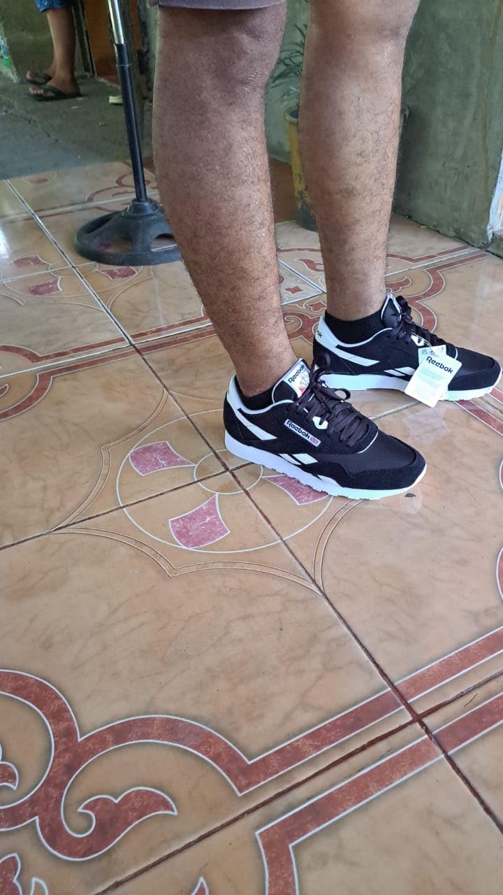 Bottom sole view of Reebok Classic showing rubber outsole pattern and traction design