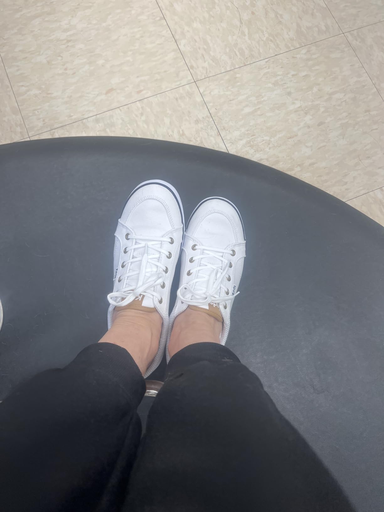 Keds Center sneaker worn in professional setting showing versatile styling capability