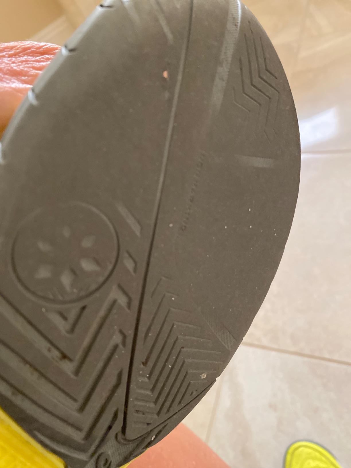 Bottom sole view showing wear patterns and tread condition after months of pickleball and tennis use