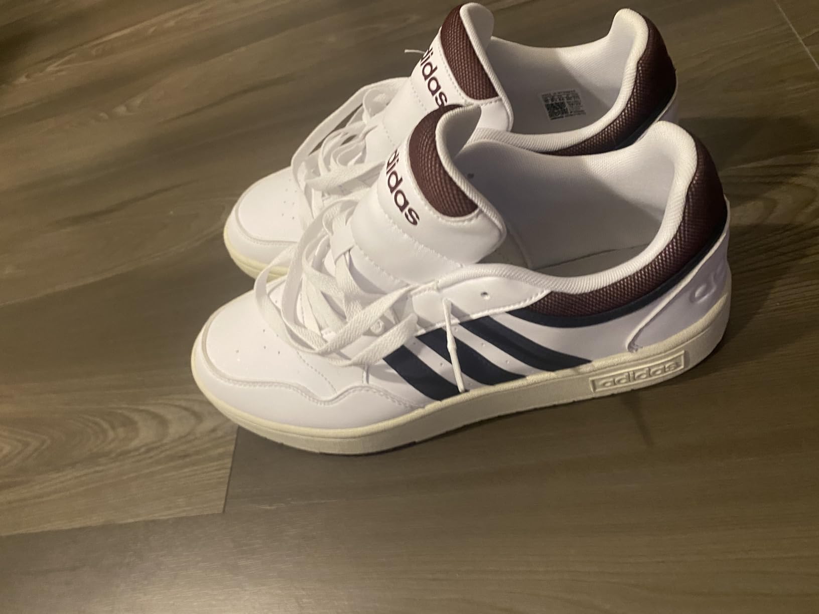 Detail shot of Adidas three stripes logo and construction quality on Hoops 3.0 basketball shoe