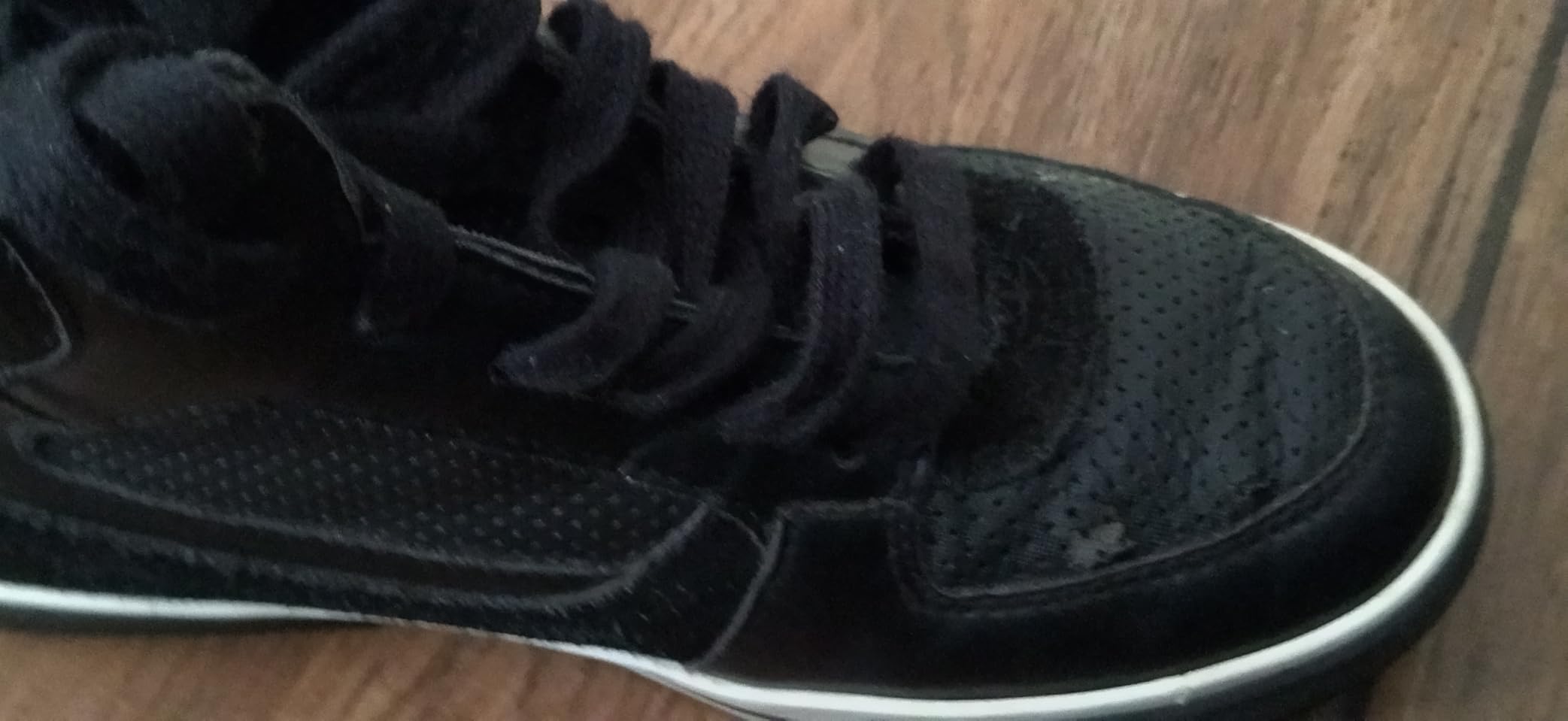Nautica kids sneaker showing signs of wear and sole separation after extended use