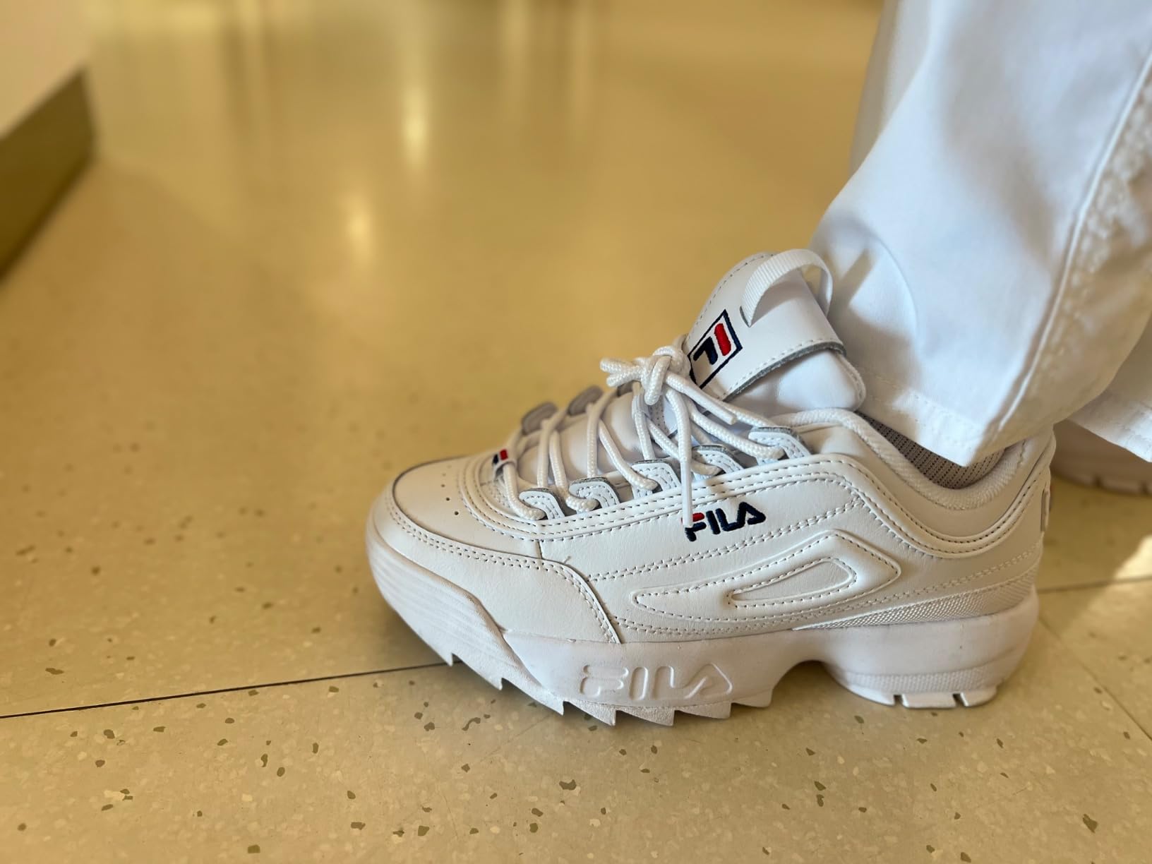 Close-up view of Fila Disruptor II leather upper construction and toe box design details