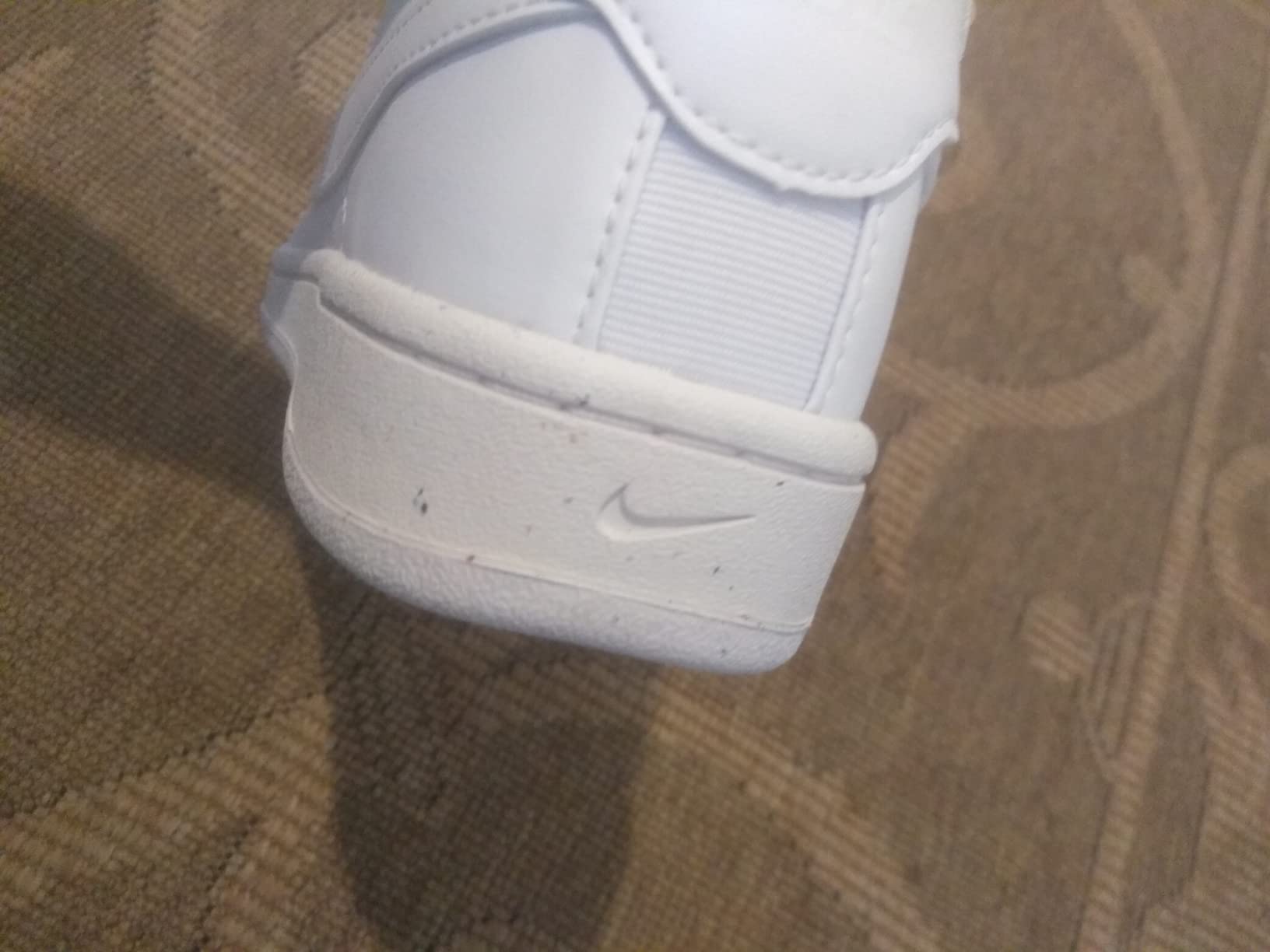 Nike tennis shoes being tested in gym environment showing versatility for cross-training activities