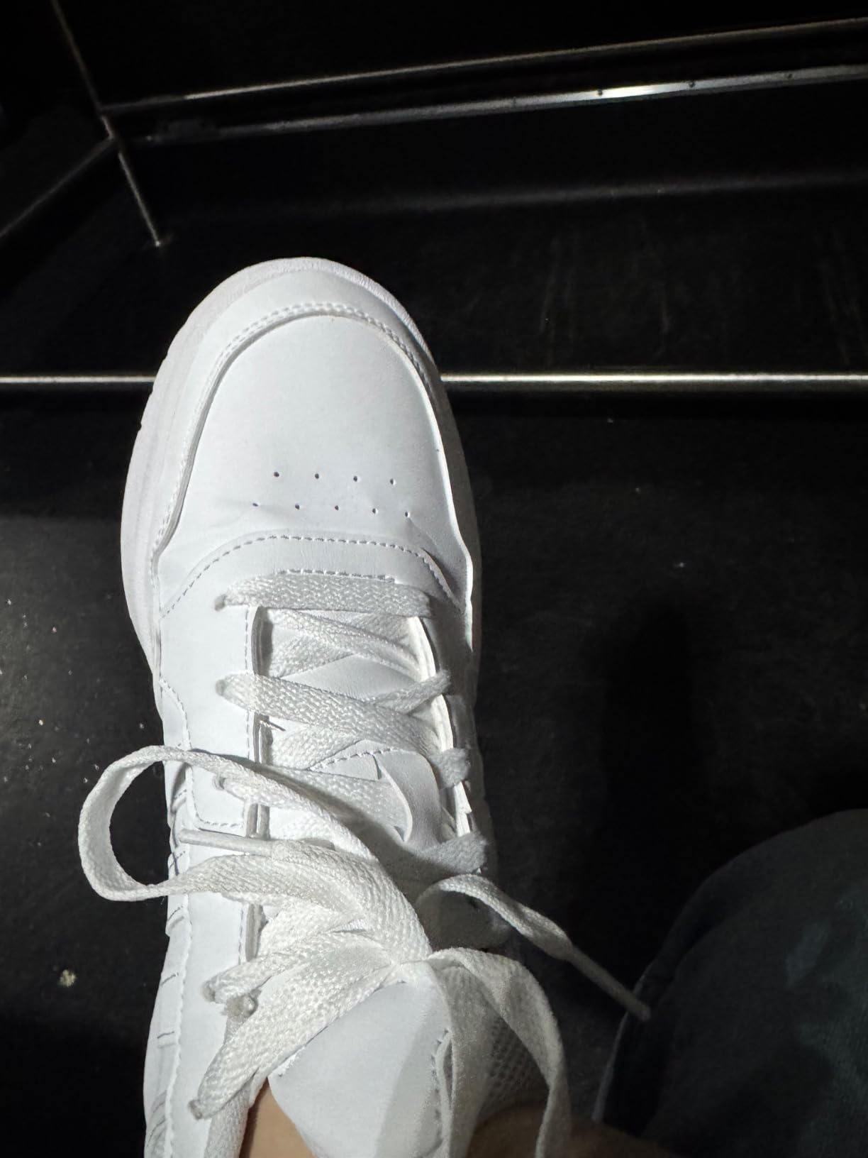 Side profile view showing the mid-cut ankle support design and rubber cupsole of Adidas Hoops 3.0