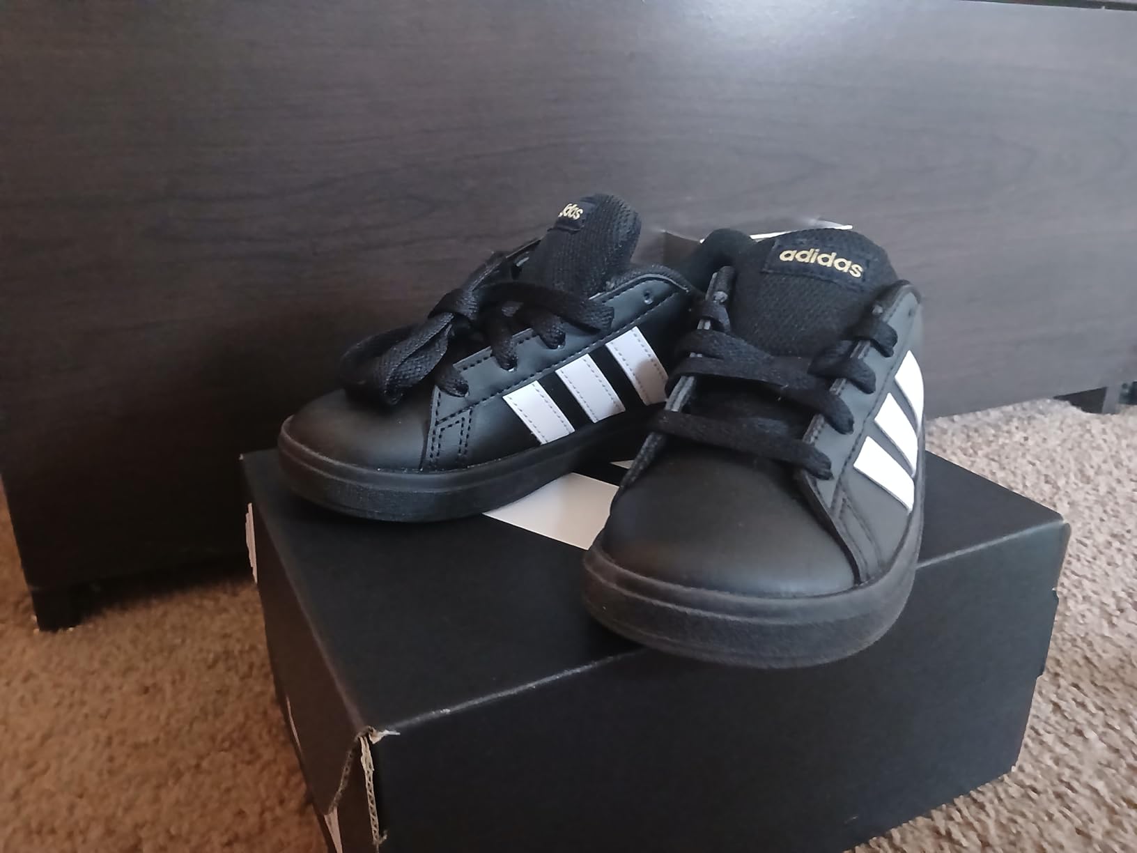Side view of Adidas Grand Court 2.0 showing the wide toe box and overall profile perfect for growing feet