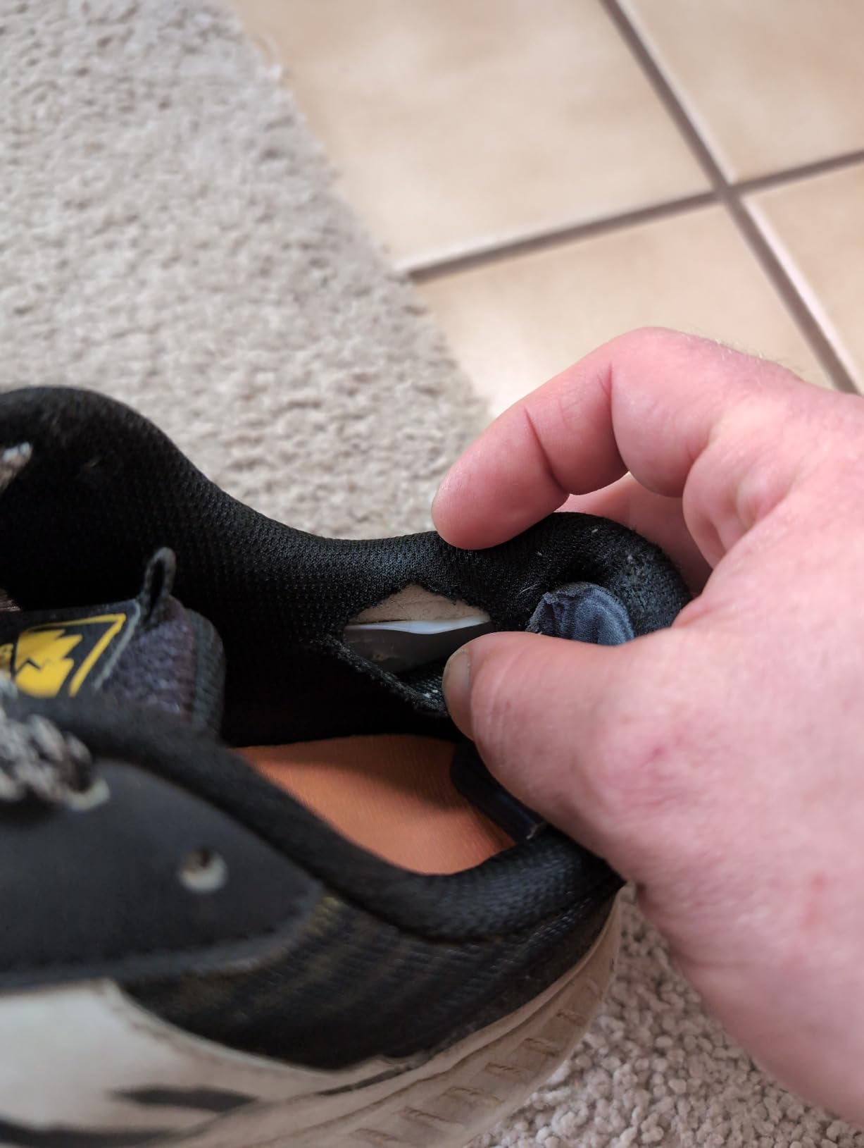 Close-up view of Saucony TR15 mesh upper construction showing breathable panels and synthetic overlays