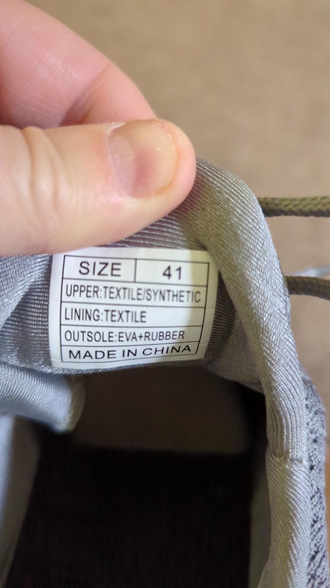 Close-up view of Feethit walking shoes showing mesh construction and rubber sole pattern