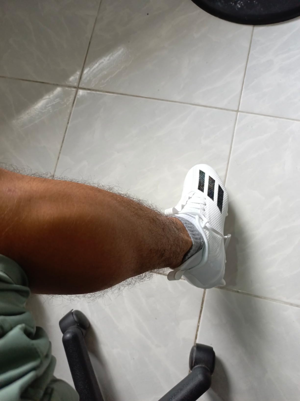 Close-up of Adidas Adizero Scorch cleat sole showing stud configuration and synthetic material