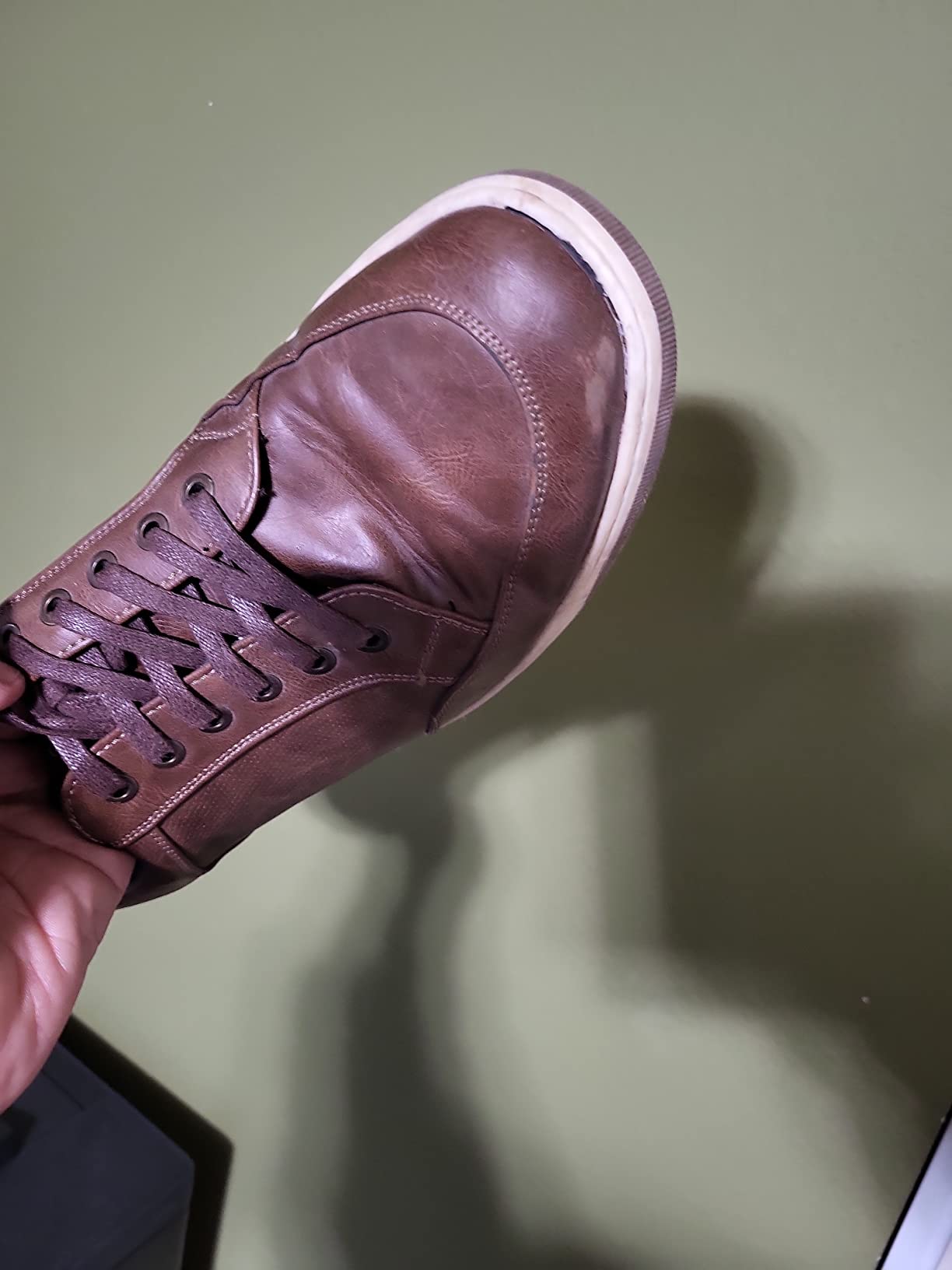 Overall view of Jousen sneakers showing both the attractive design and signs of wear after extended testing