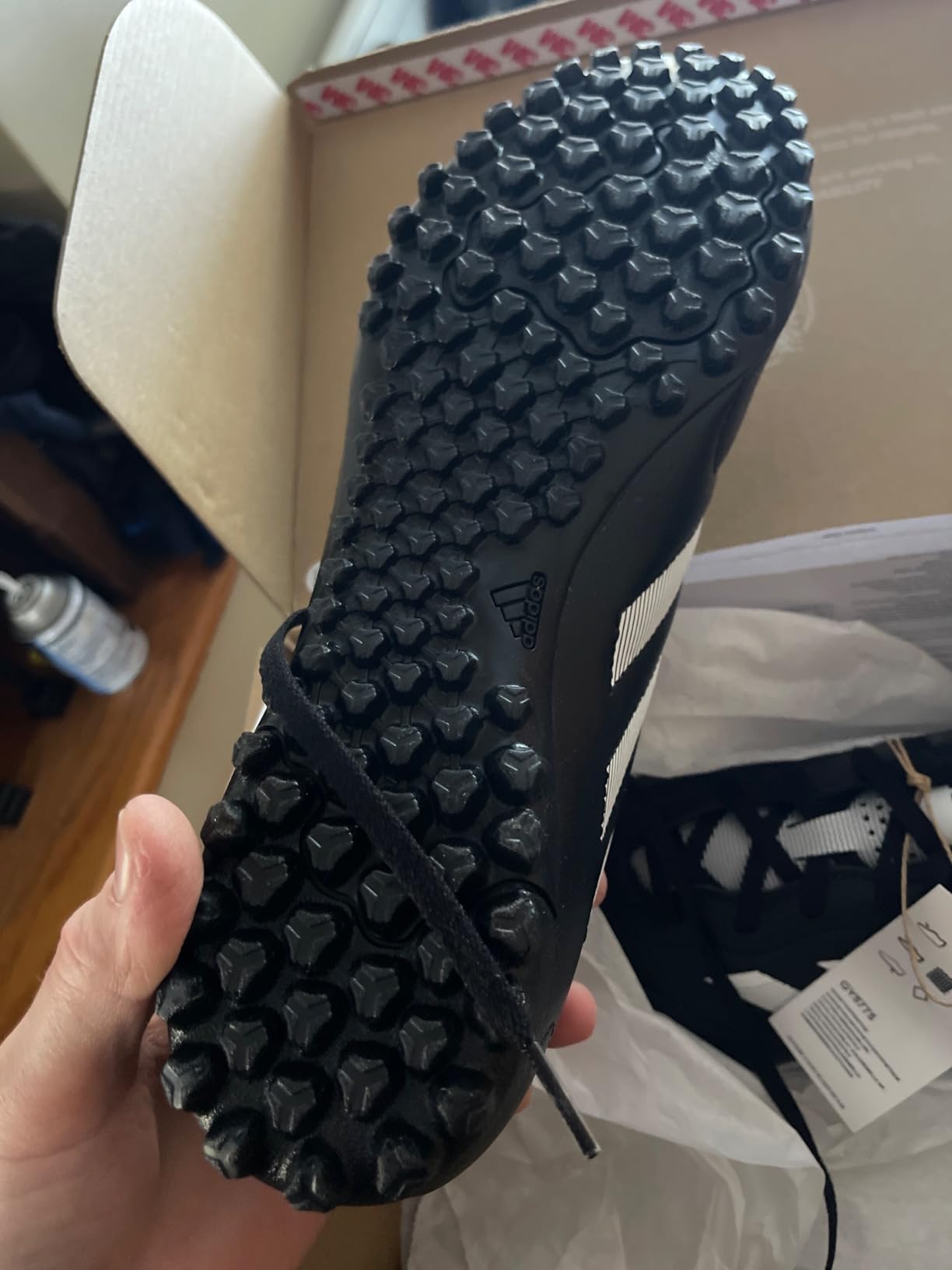 Bottom view of adidas Goletto VIII showing the specialized turf outsole with rubber lugs for artificial grass traction