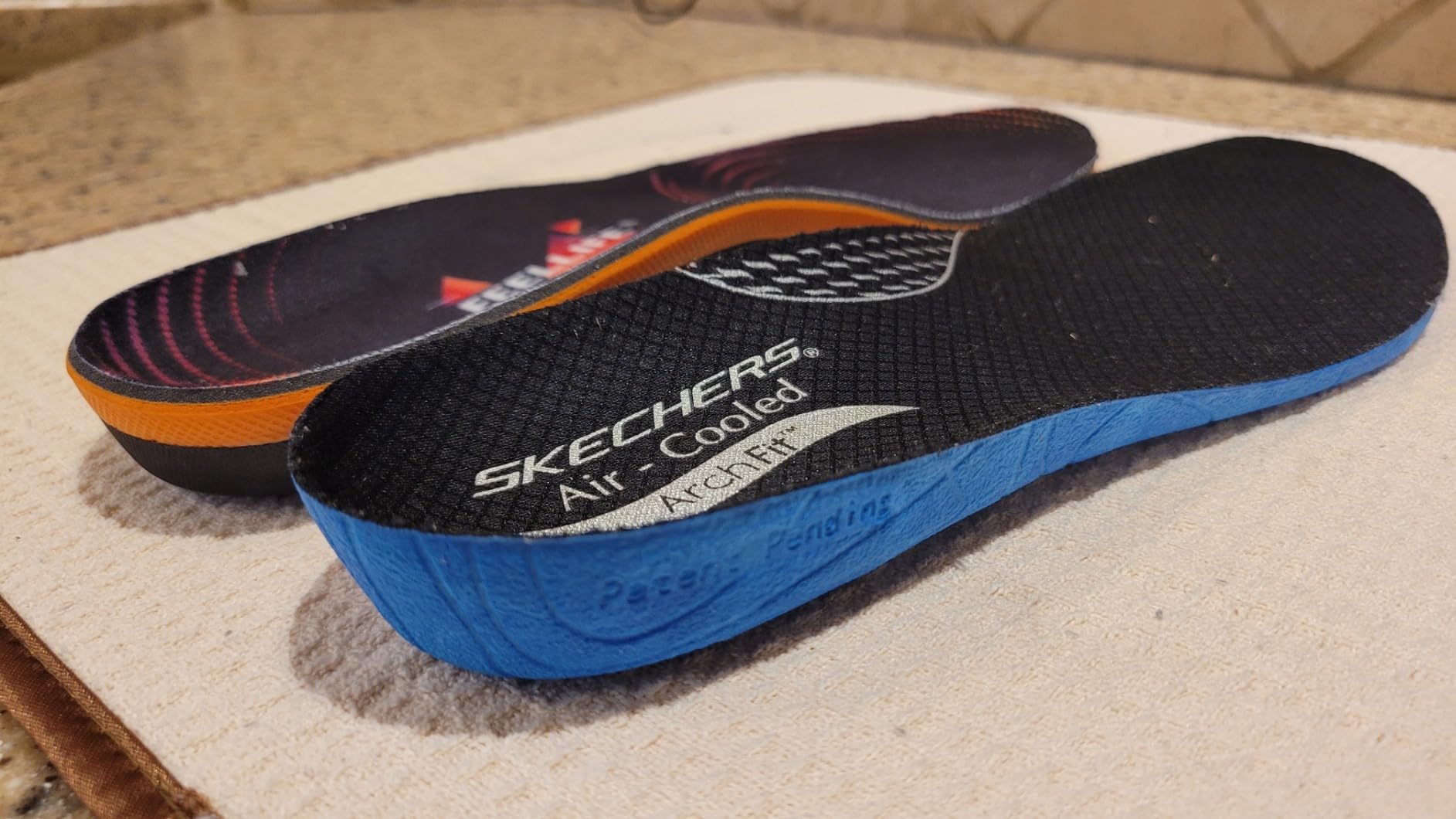 Multiple FEELLIFE insoles showing different angles and construction details