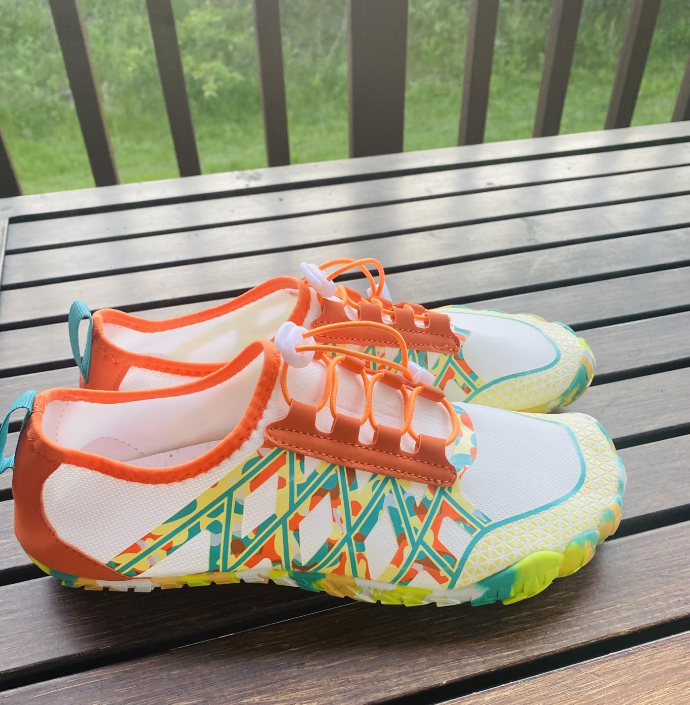 Water shoes showing flexible sole with drainage holes and non-slip tread pattern
