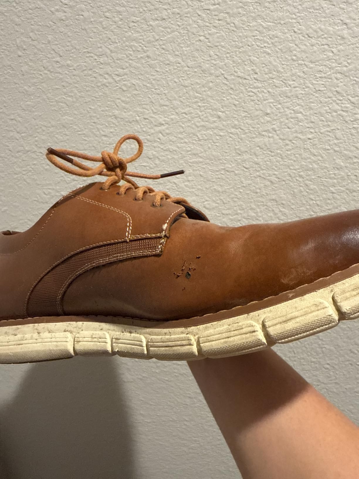 Bruno Marc dress sneaker showing advanced material deterioration after extended wear demonstrating durability concerns