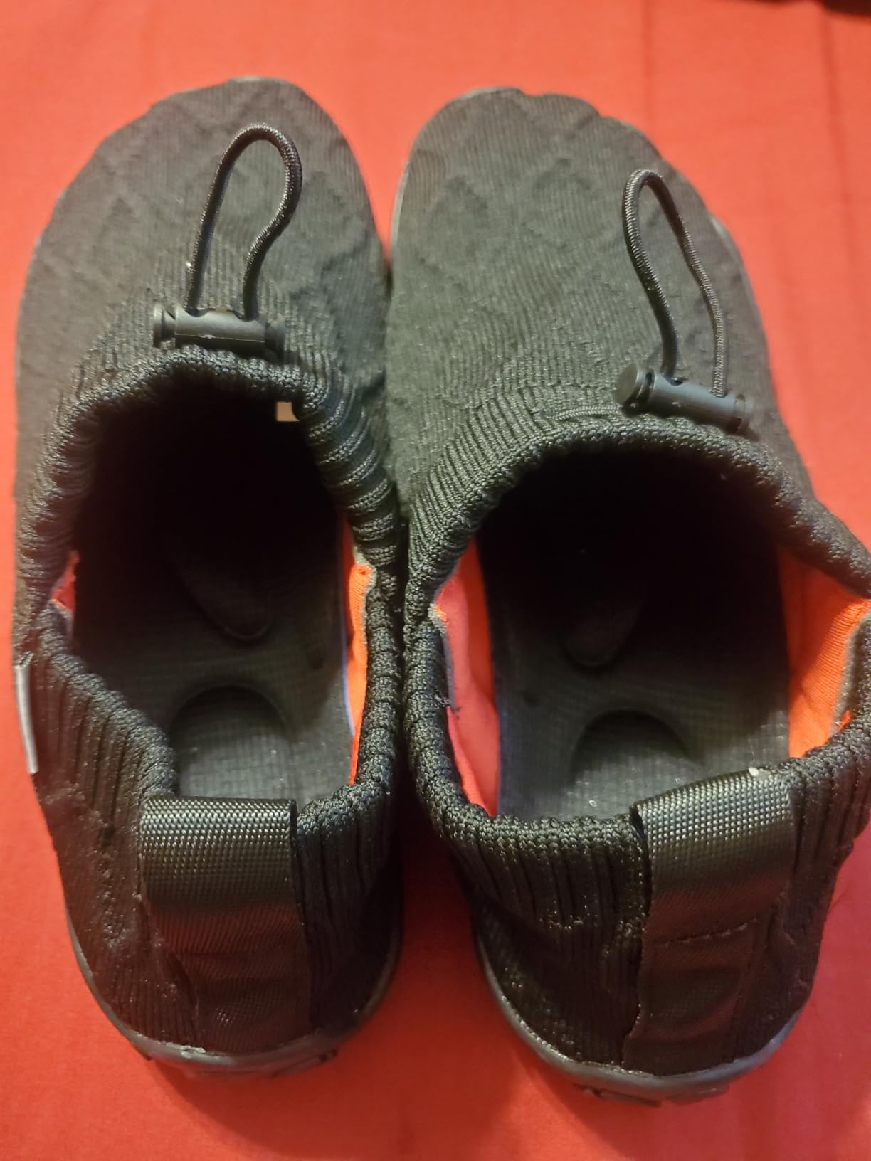 Side profile of WateLves barefoot shoe showing knit upper construction and slip-on design with heel strap