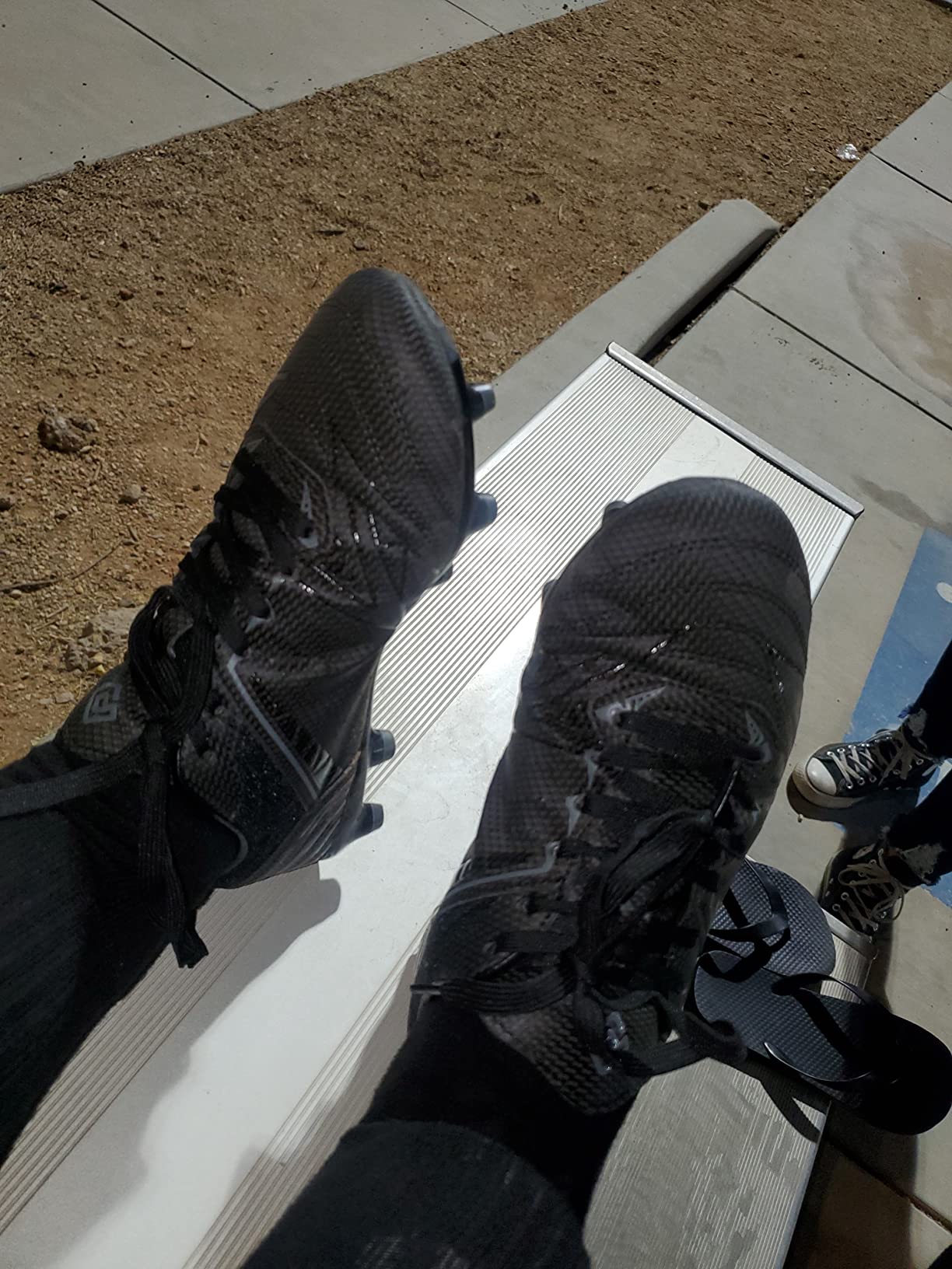 DREAM PAIRS soccer cleats in action during field testing showing wear patterns