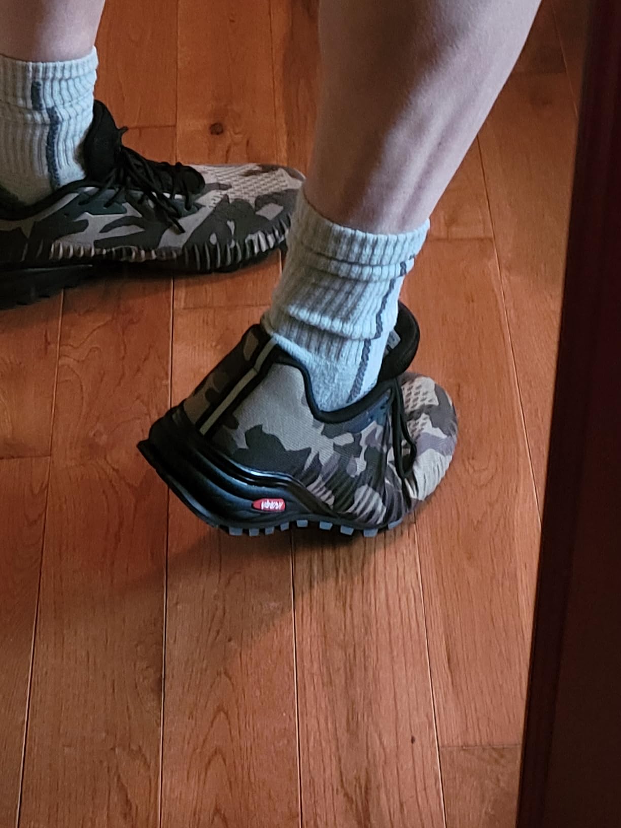 Action shot of Kricely trail shoes on rocky terrain showing real-world usage