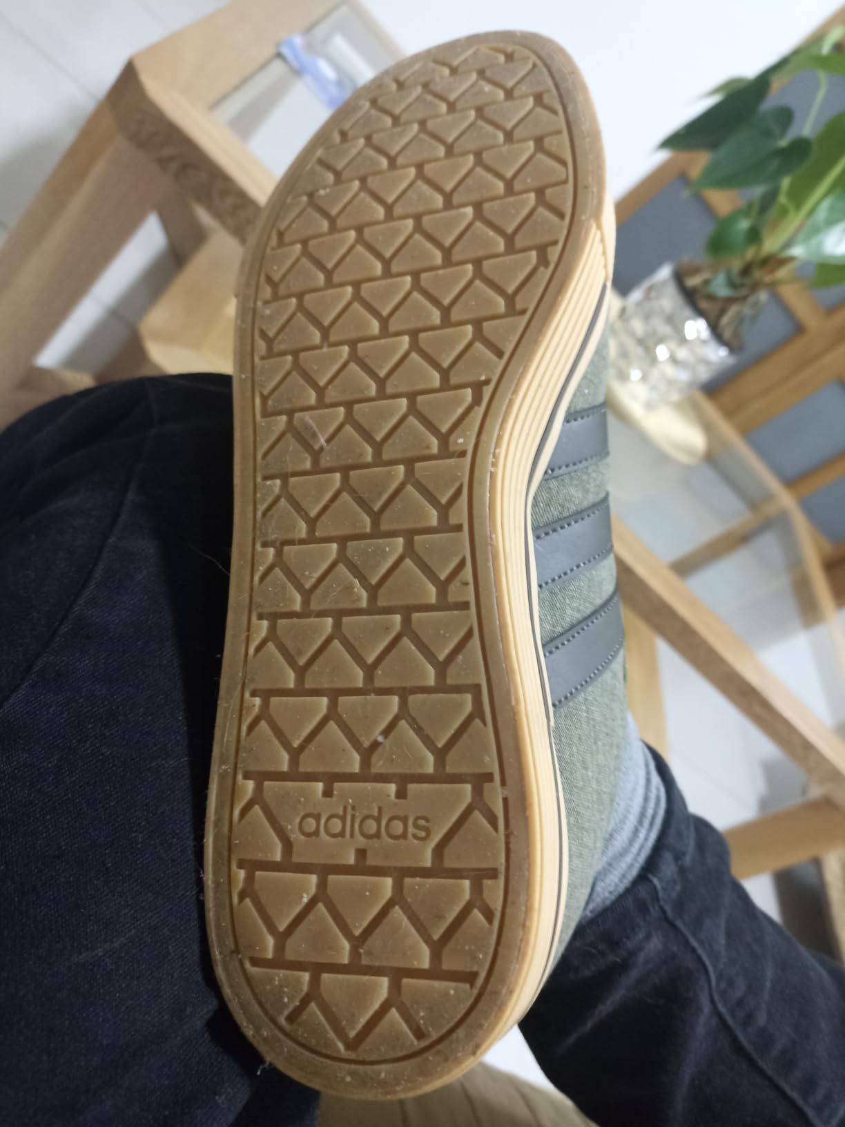 Side view of Adidas Daily 4.0 sneakers showing profile and rubber outsole pattern