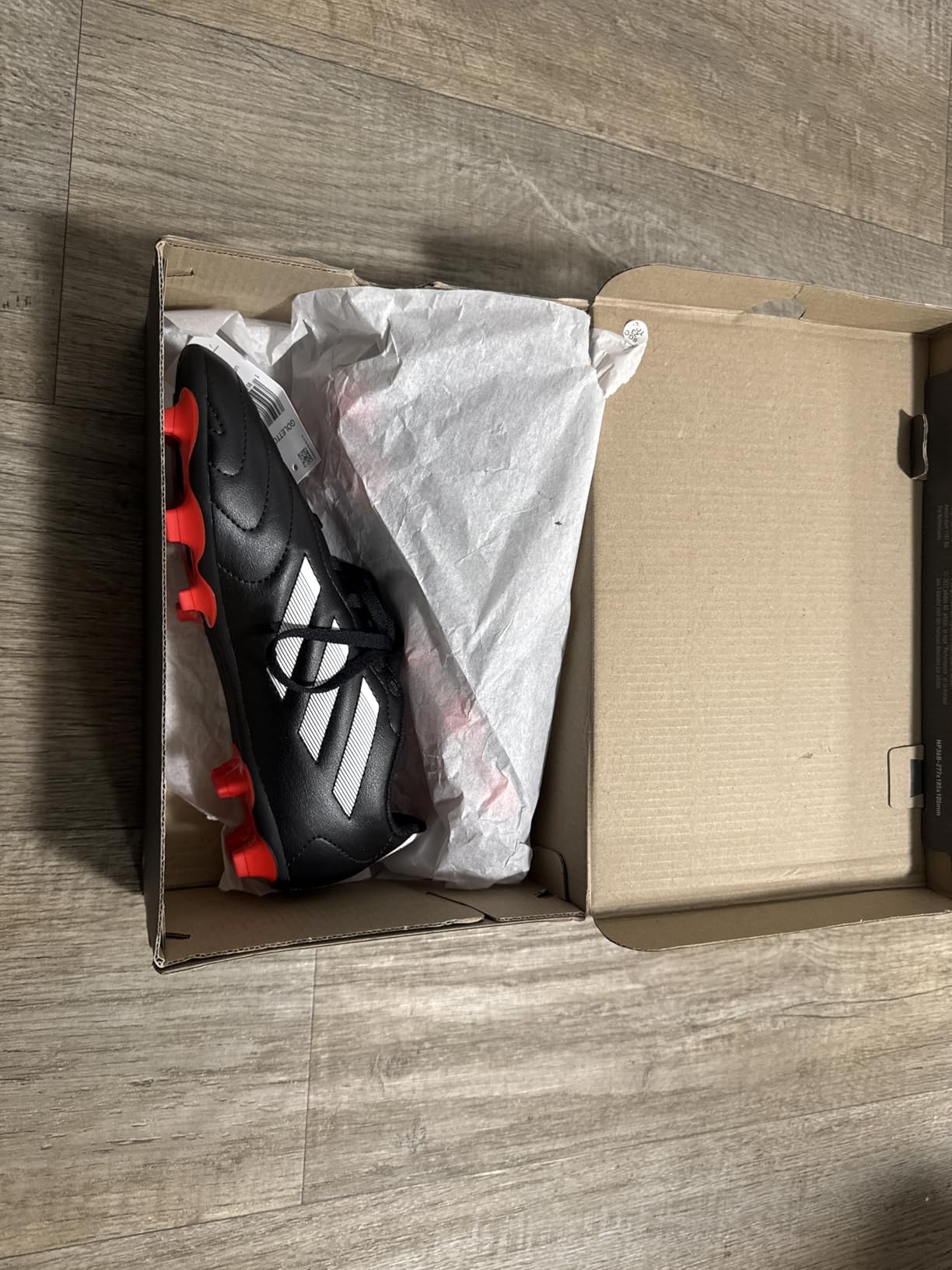 Adidas Goletto VII cleat showing side profile with classic three stripes design