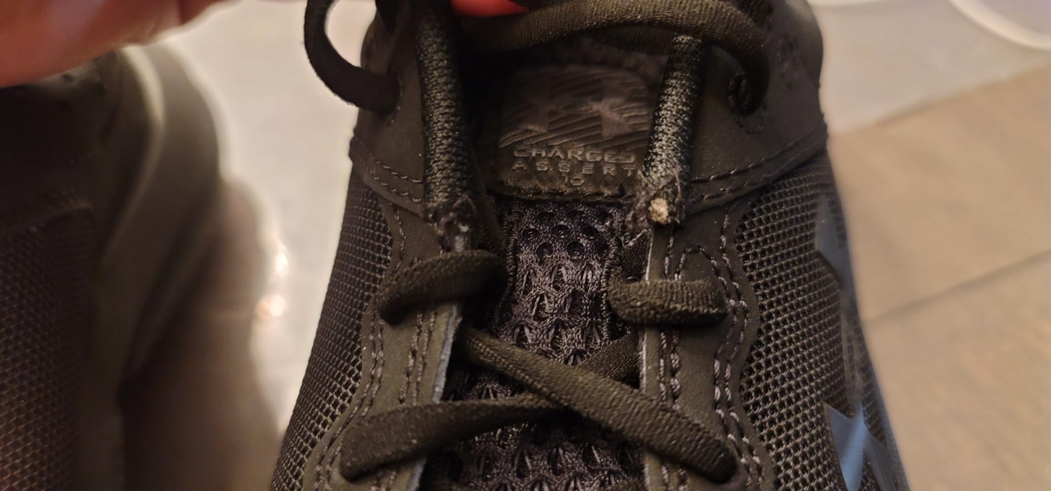 Under Armour Assert 10 showing overall construction and design from multiple angles