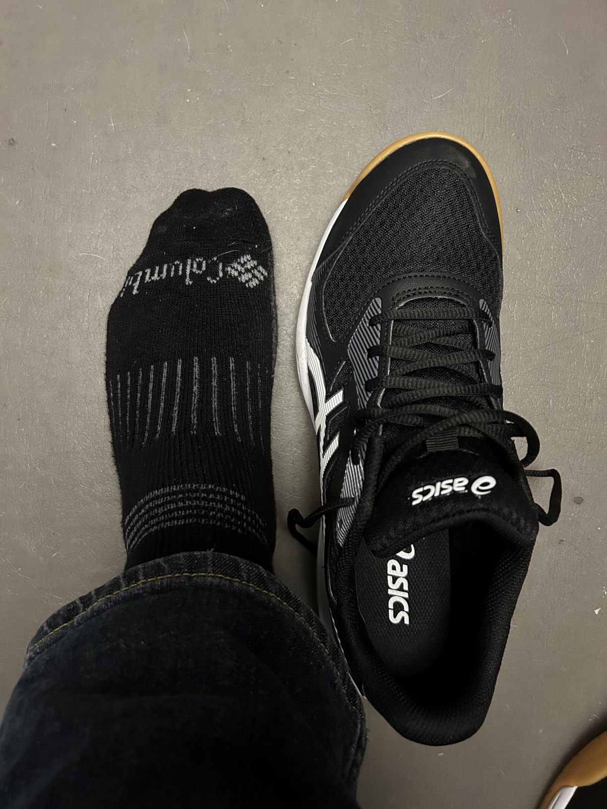 ASICS Upcourt 5 on foot showing narrow fit profile and toe box shape