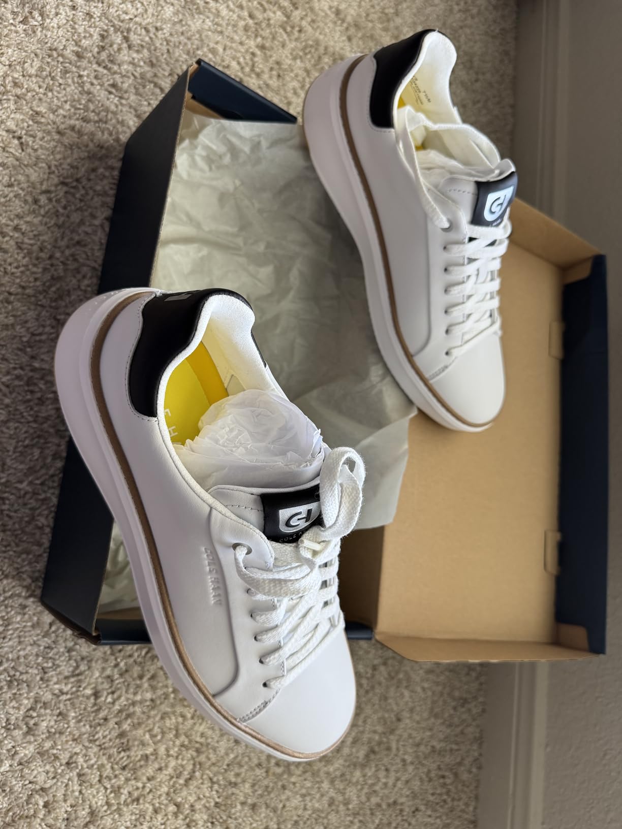 Cole Haan Men's Grandpro Topspin Sneaker in white leather showing premium construction and golf-inspired design