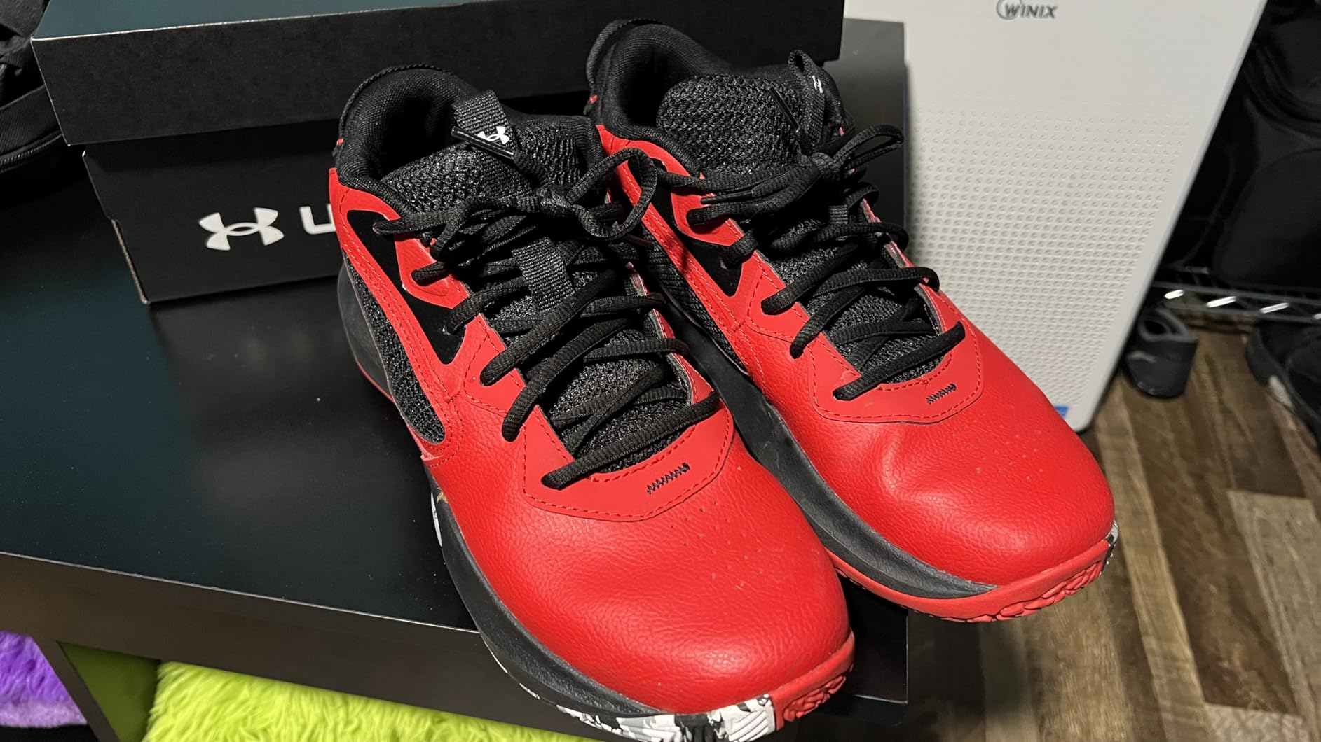 Under Armour Lockdown 6 basketball shoes showing black colorway with leather upper and mesh panels