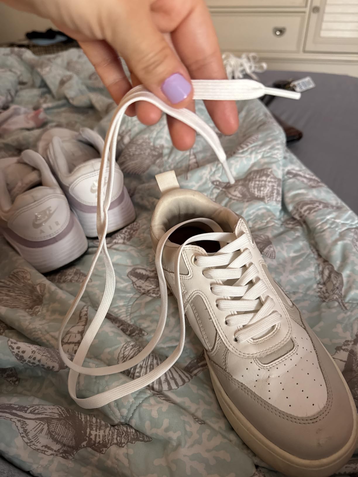 Multiple pairs of ZHENTOR shoelaces showing versatility across different sneaker styles