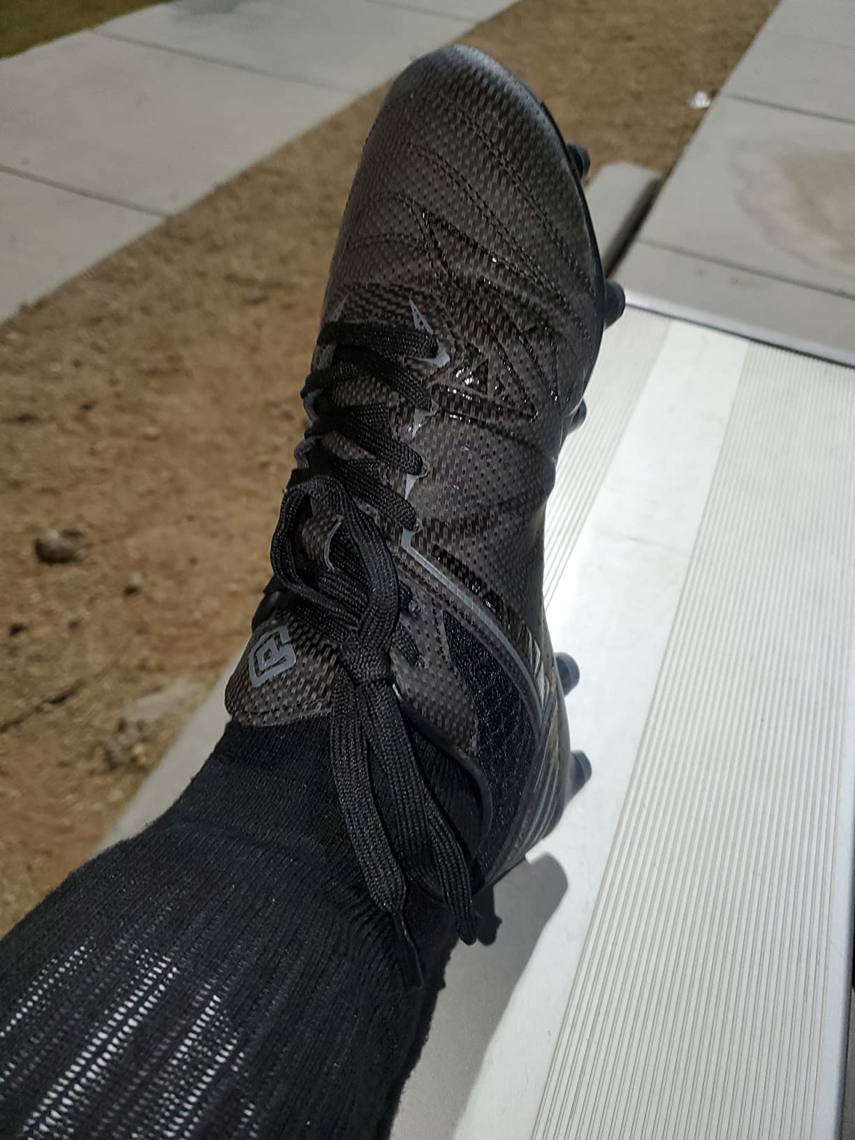 DREAM PAIRS soccer cleats tested on different surfaces showing adaptability