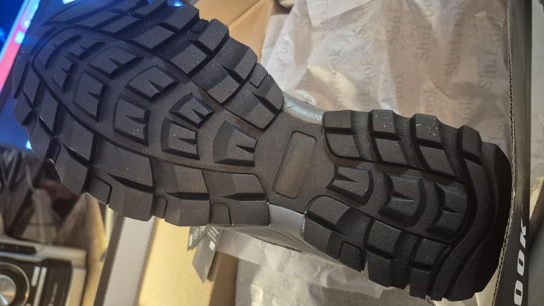 Close-up view of SHULOOK hiking shoe upper construction showing suede leather and mesh panels