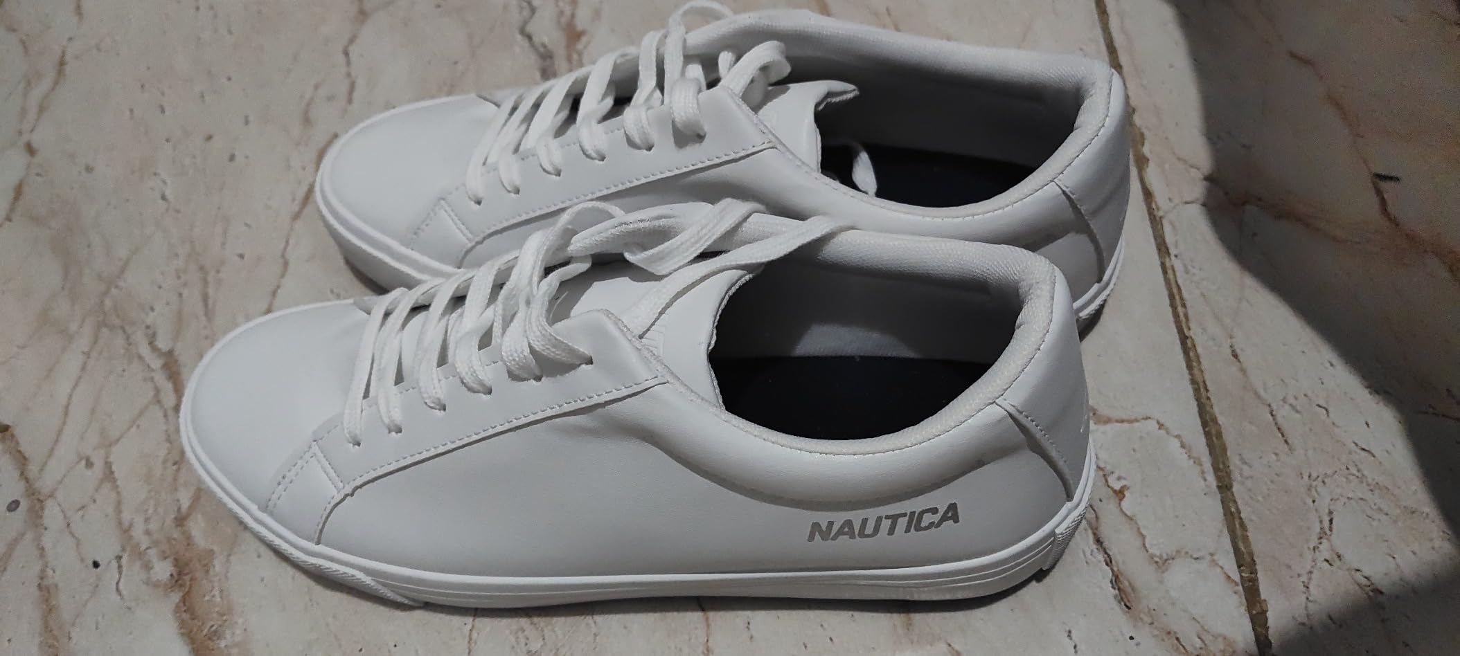 Marketing comparison showing Nautica shoe features versus real-world performance testing