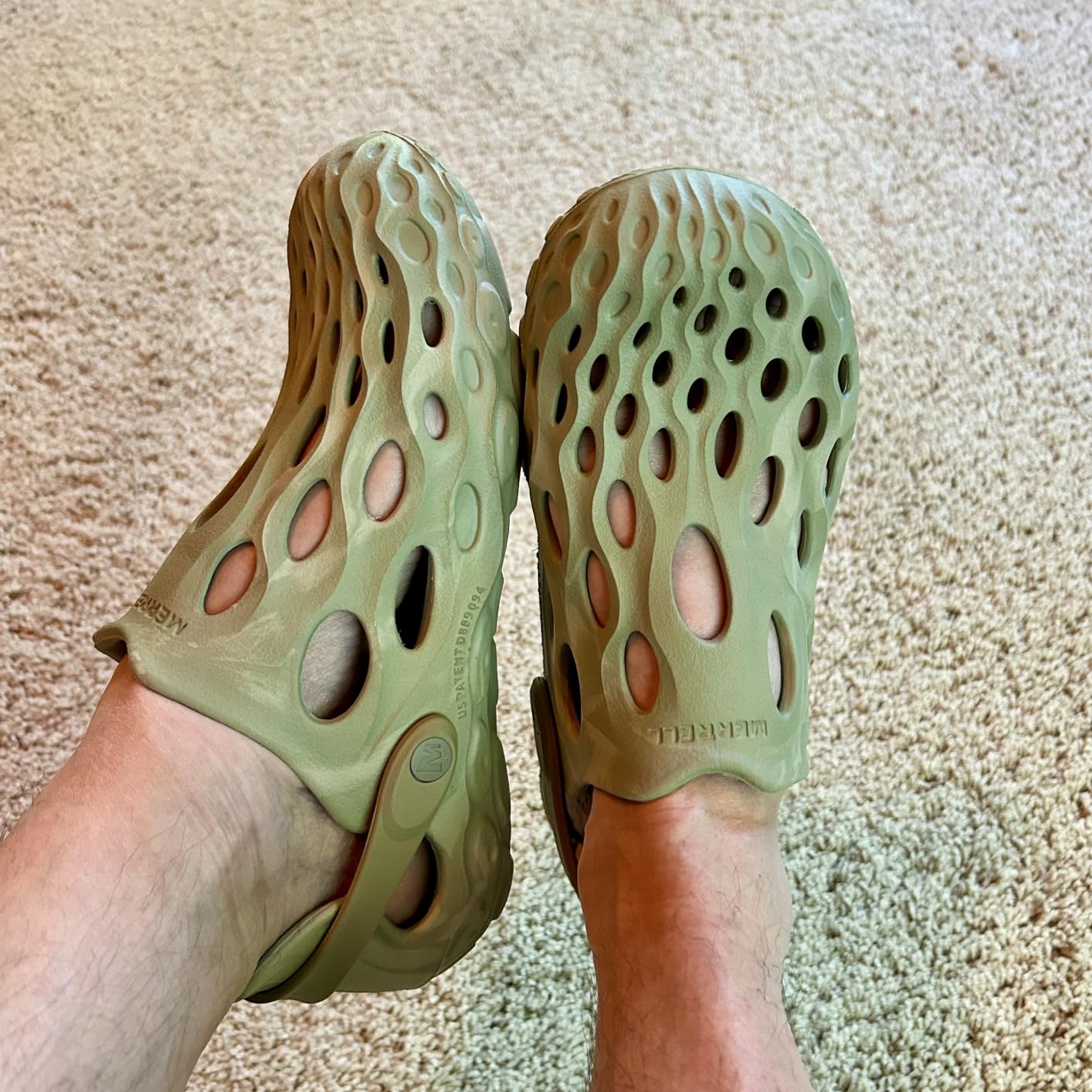 Side profile showing Merrell Hydro Moc's distinctive raised toe design and ventilation holes